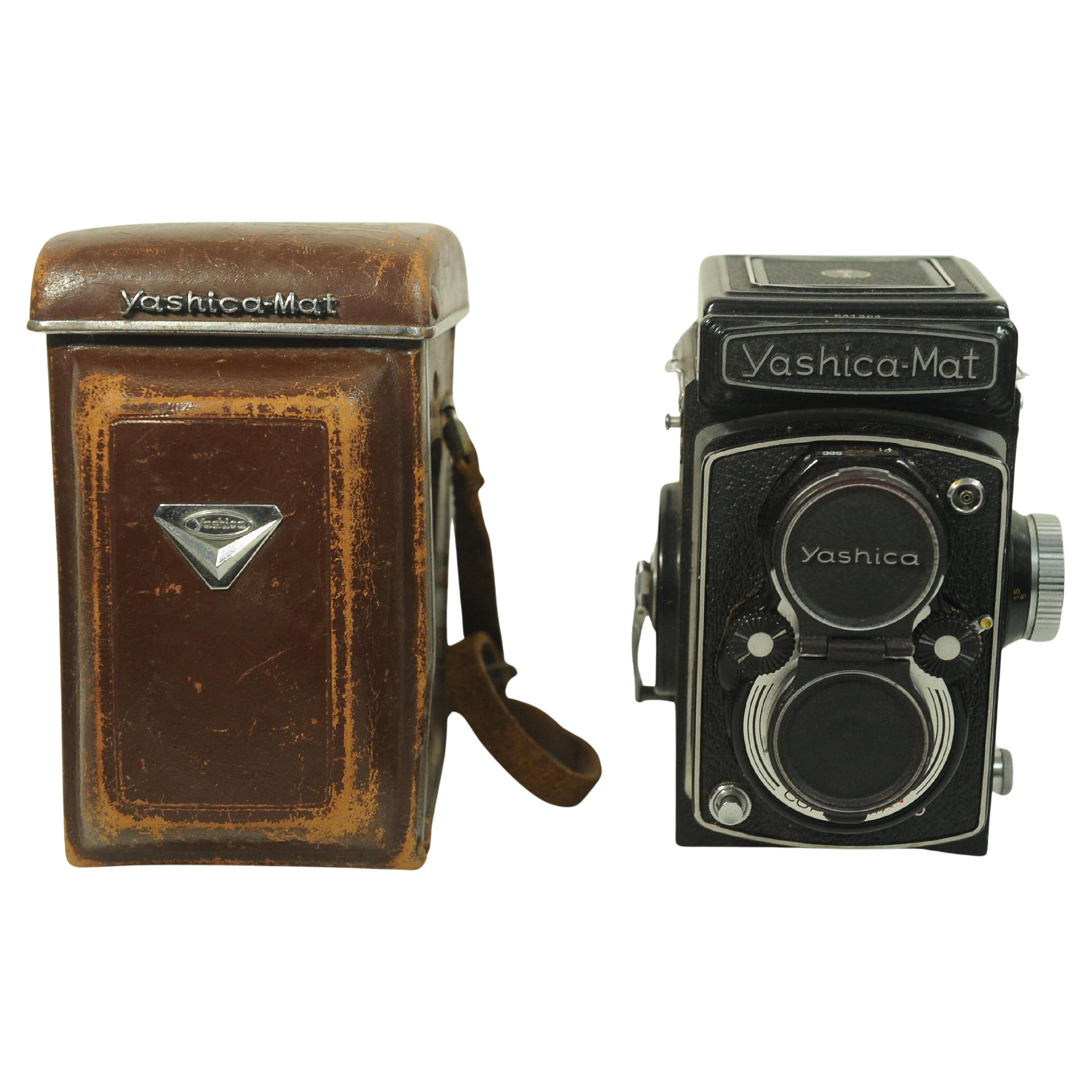 Yashica-Mat Twin Lens Reflex Medium Format Camera With a Yashinon 80mm F3.5 Prime Fixed Lens 

Takes Medium Format Roll Film Comes With Original With Brown Leather Yashica Case.

Yashica-Mat is one of the most gorgeous, under-rated TLR cameras made. 