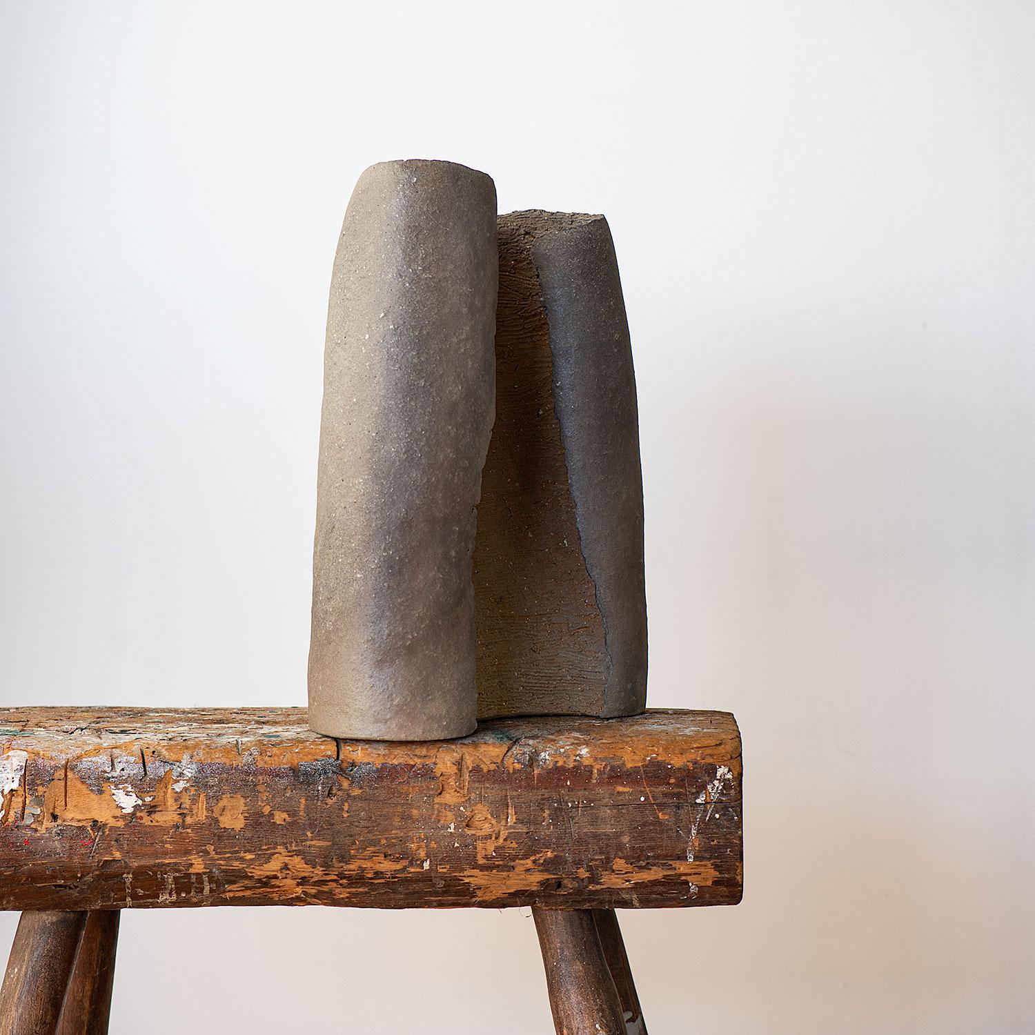 Yasuhisa Kohyama shapes his asymmetrical forms using piano wire, creating distinctive rough surfaces. The clay with its feldspar nuggets creates a tactile quality rarely seen in contemporary work. No glaze is used, but the wood ash and placement in