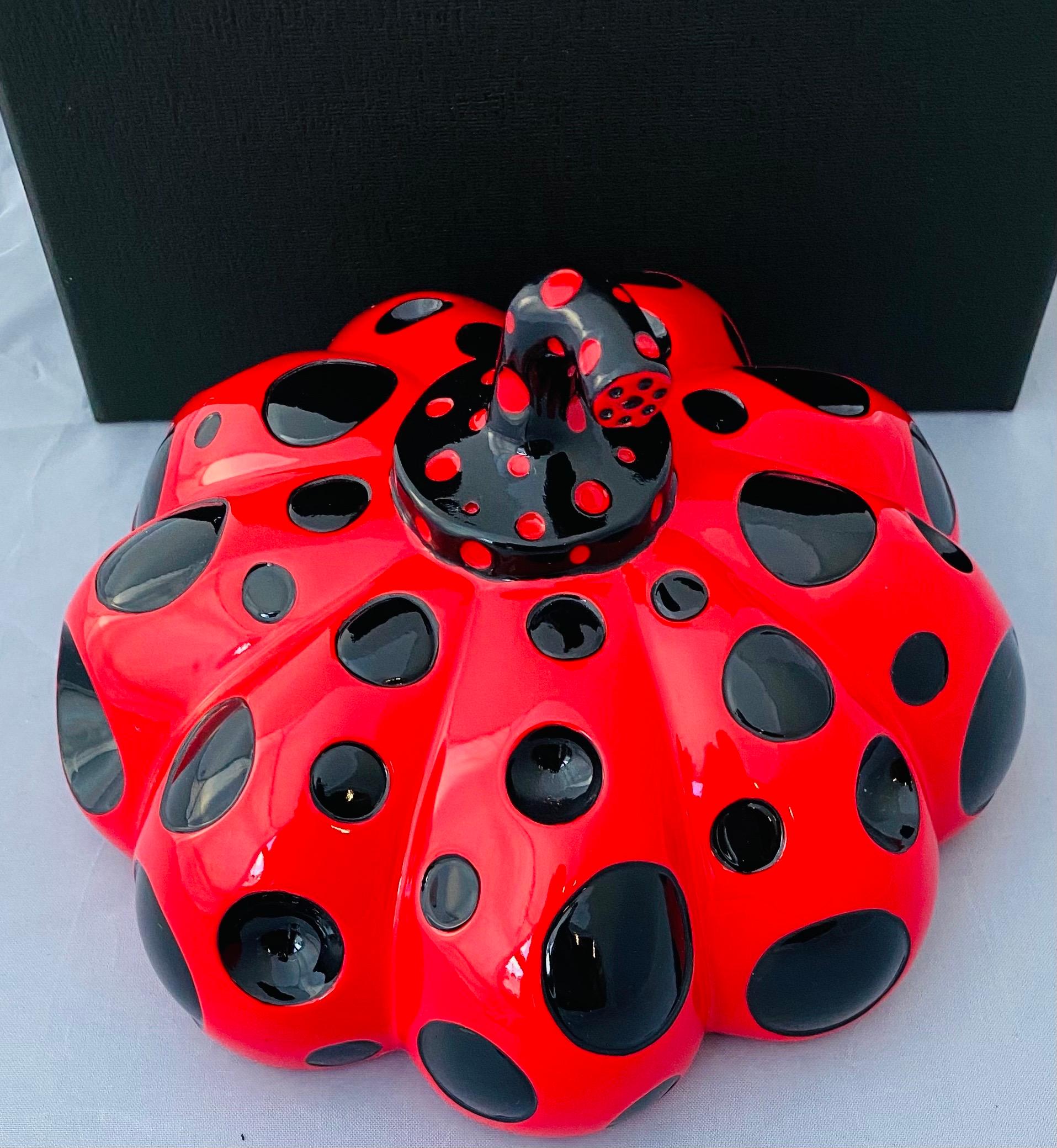 Yayoi Kusama Red & Black Pumpkin 2019:
An iconic, vibrantly colored pop art piece - this rare, sought-after red Kusama pumpkin sculpture features the universal polka dot patterns and bold colors for which the artist is perhaps best known. Kusama