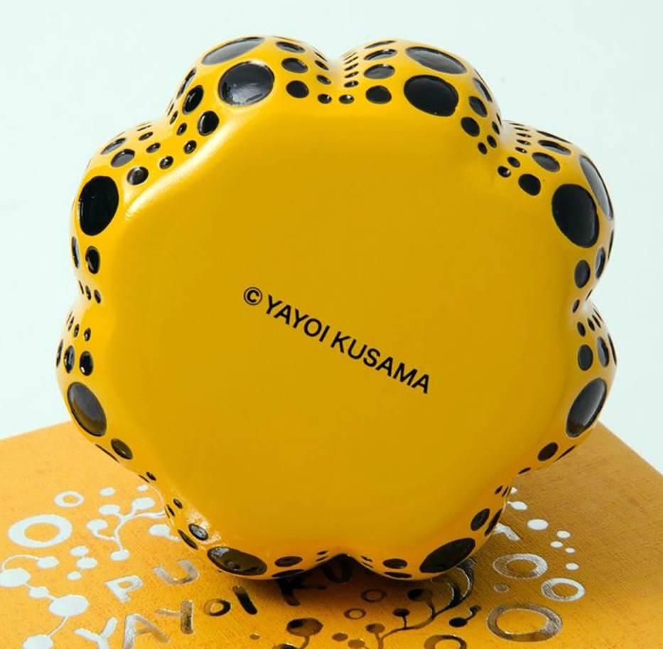 Yayoi Kusama Yellow Pumpkin: 
An iconic, vibrantly colored pop art piece - this small Kusama pumpkin sculpture features the universal polka dot patterns and bold colors for which the artist is perhaps best known. Kusama first used the pumpkin at the