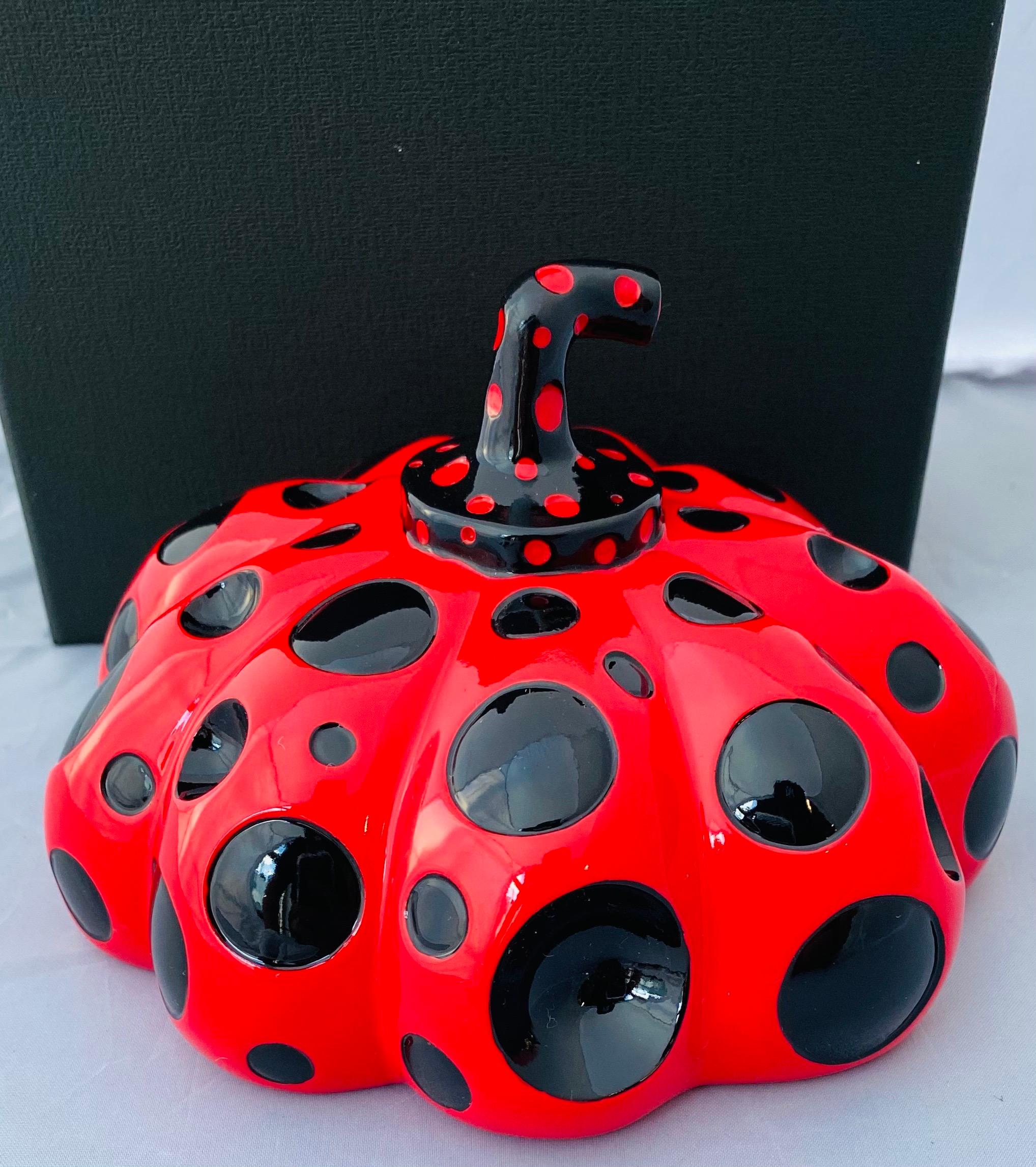 Yayoi Kusama Red & Black Pumpkin 2019:
An iconic, vibrantly colored pop art piece - this rare, sought-after red Kusama pumpkin sculpture features the universal polka dot patterns and bold colors for which the artist is perhaps best known. Kusama