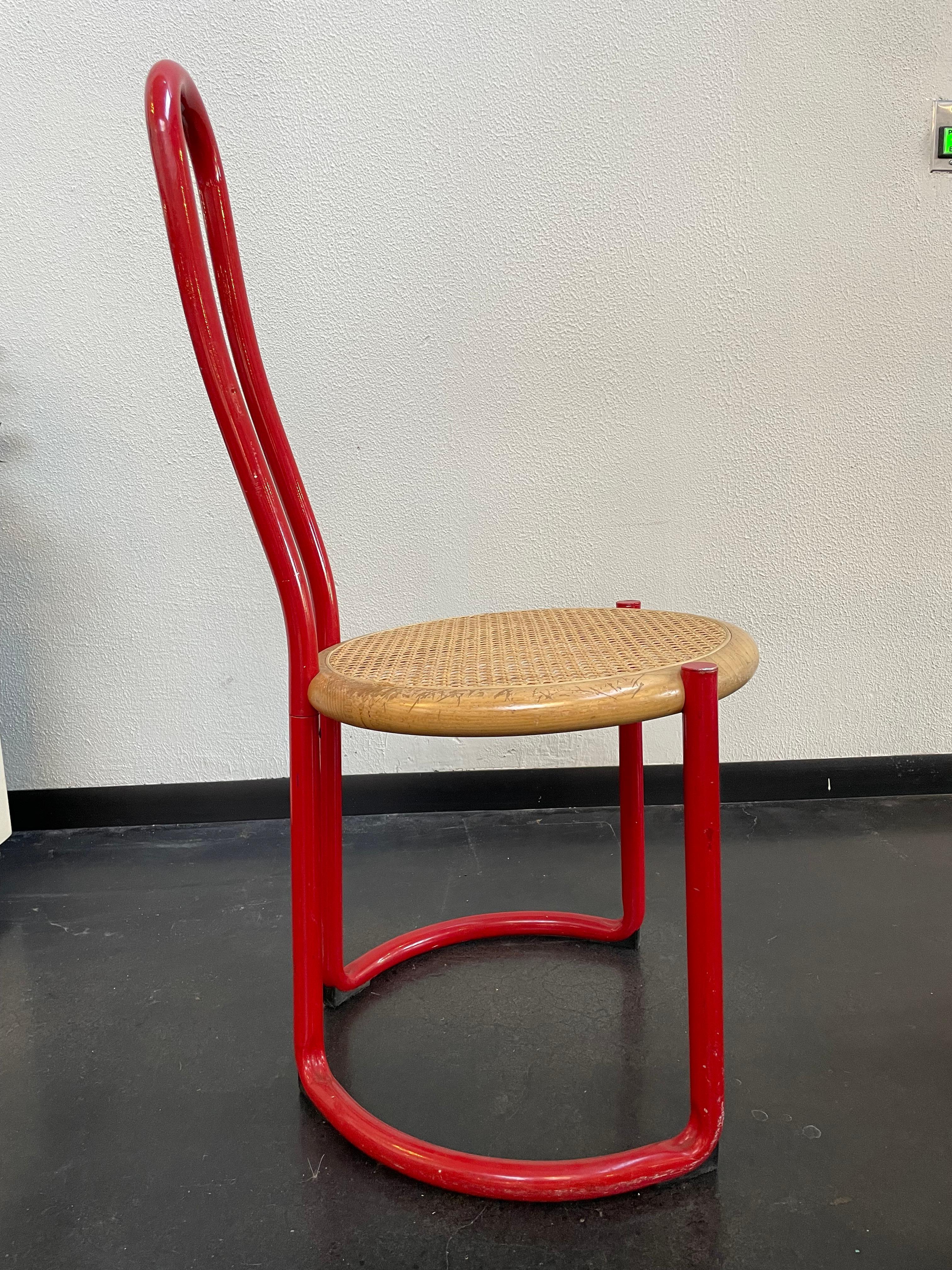 Incredibly Unique Ycami red Italian metal and cain dining chairs (set of 4).