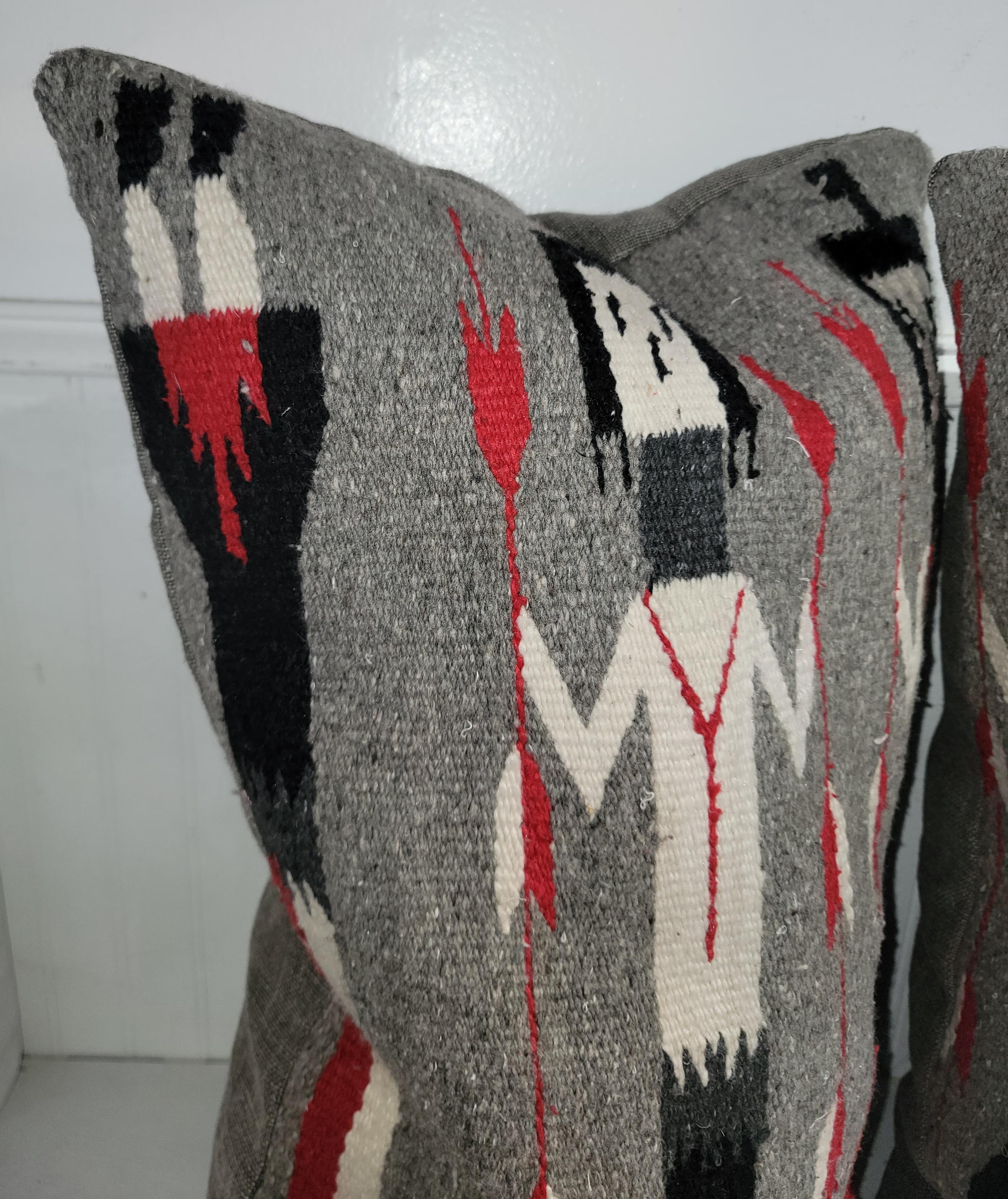 Navajo Indian weaving Yea weaving pillows with thick grey linen backings.The condition are very good.The inserts are down & feather fill.