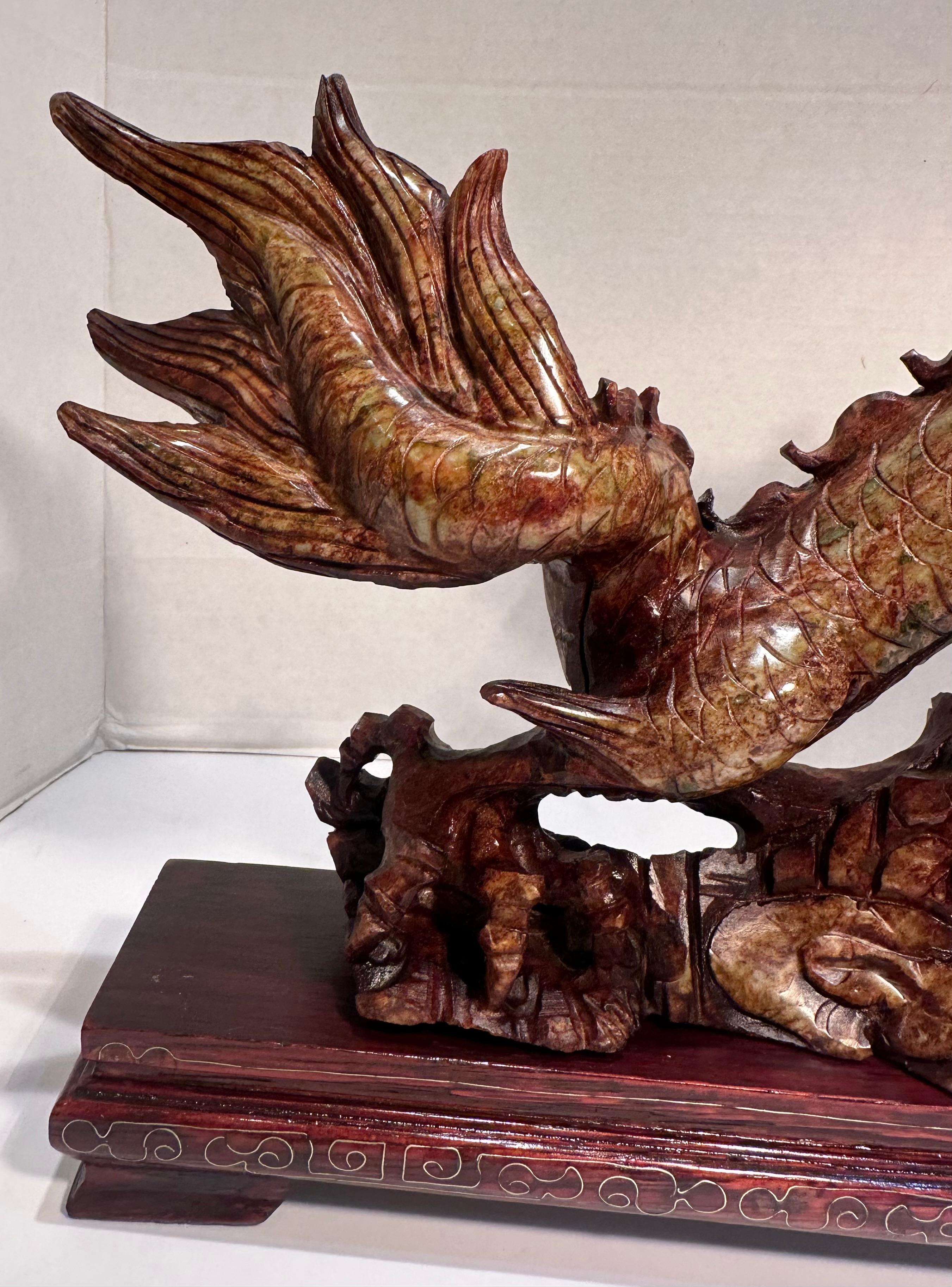 Chinese Export Year of the Dragon Elaborate Hand Carved Stone Dragon Sculpture on Rosewood Base For Sale