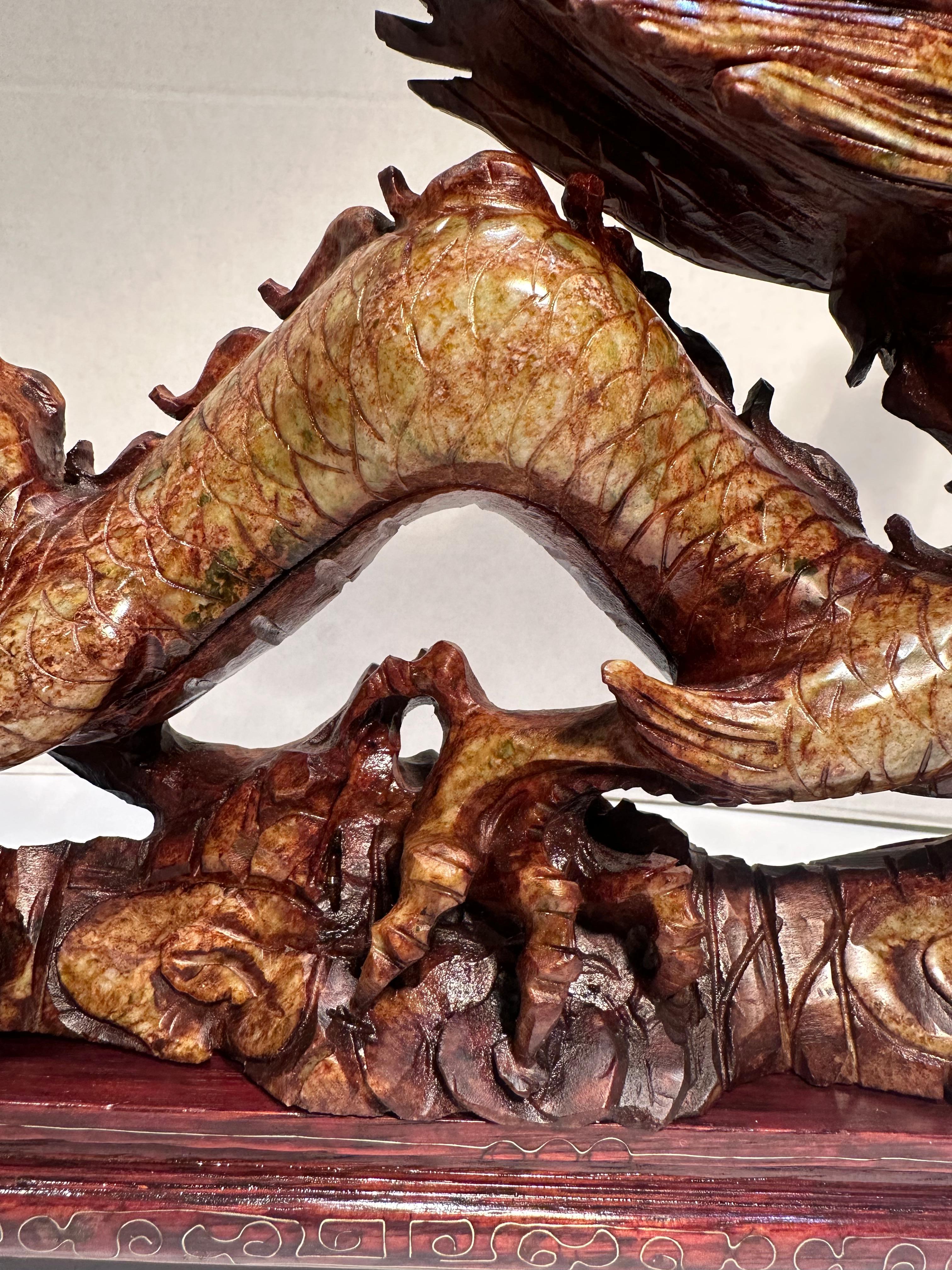 Chinese Year of the Dragon Elaborate Hand Carved Stone Dragon Sculpture on Rosewood Base For Sale