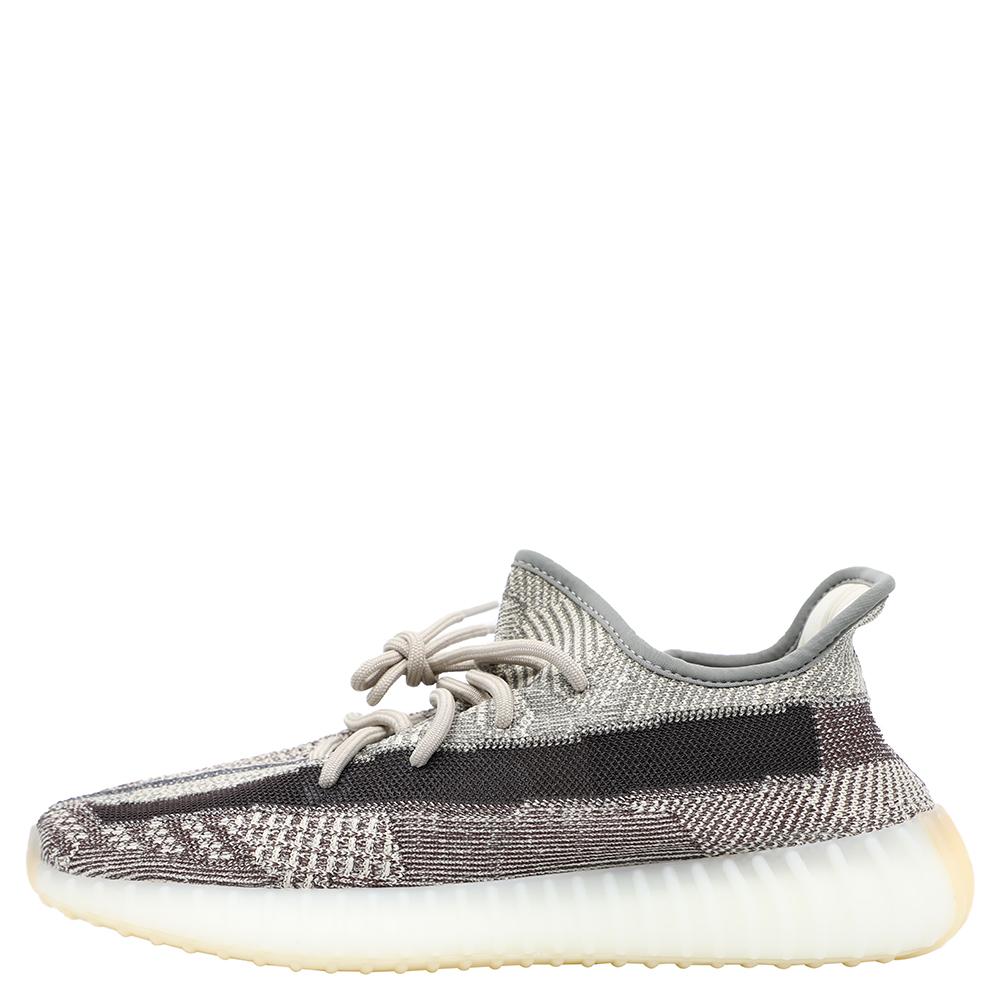 Released in 2020, the adidas Yeezy 350 Zyon has mocha hues with the side stripe presented in dark brown. The shoe has the Primeknit upper, Boost cushioning and lace-up fastening.