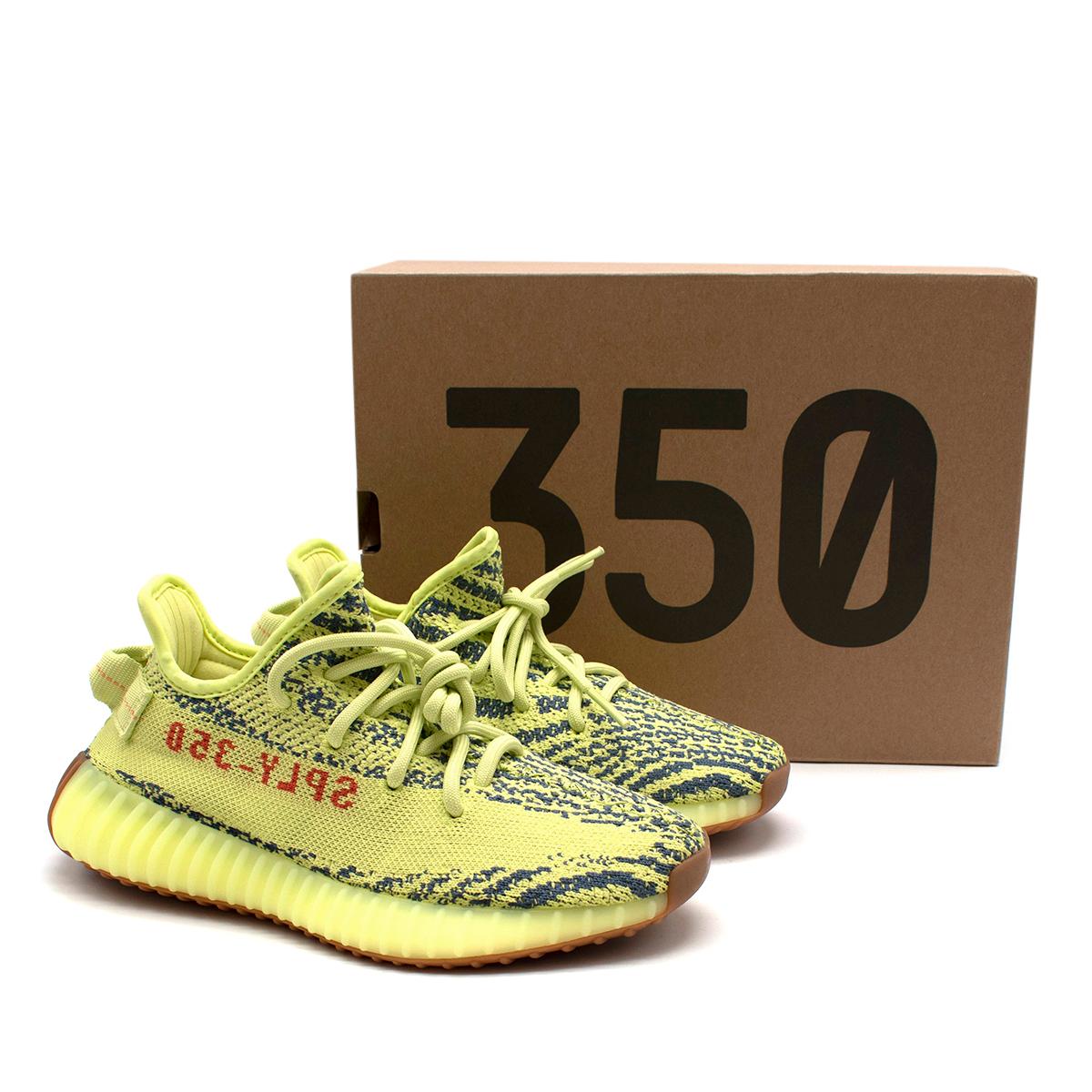 Yeezy Neon Yellow Boost 350 V2 Trainers 

- Made of breathable knit like mesh 
- Iconic stile 
- Bright neon yellow hue 
- Lace up fastening 
- Rubber soles 
- Original box 
- Practical versatile style 

Materials:
Mesh and rubber 

Made in China