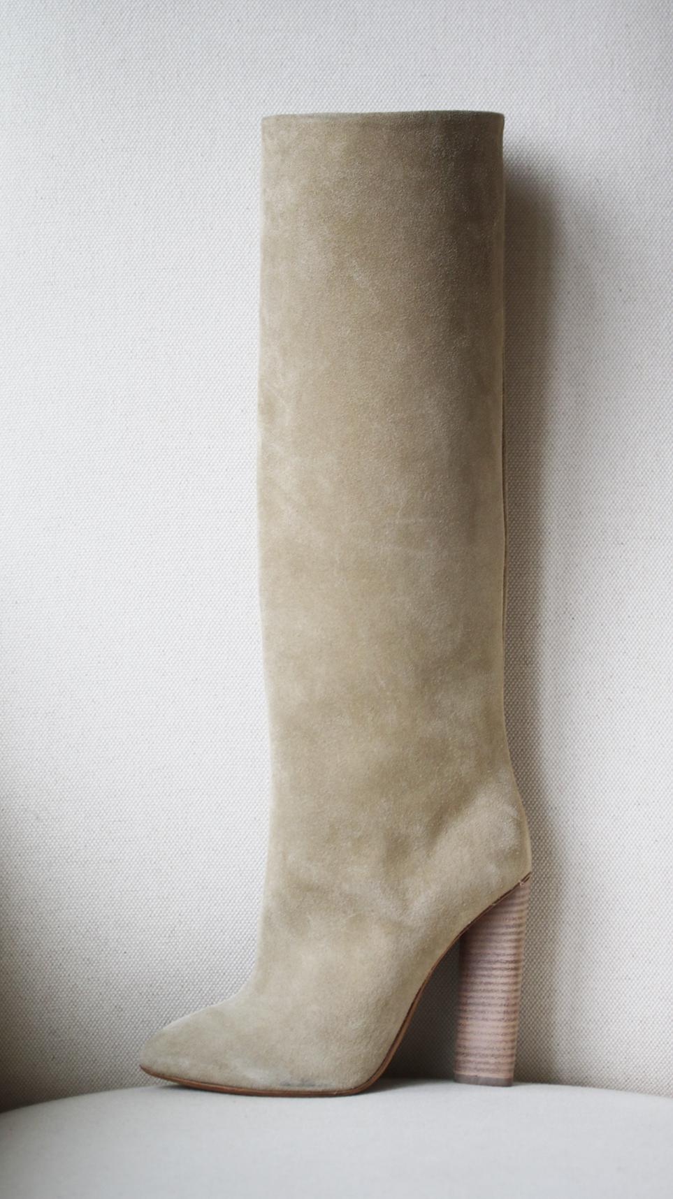 Beige suede tubular knee-high boots by Yeezy. Part of season 3. Pointed toe.  Stacked wooden heels. 100% Suede. Colour: beige.  Heel measures approx. 4.5 inches. Does not come with a box. 

Size: EU 38 (UK 5, US 8)

Condition: New without box. 