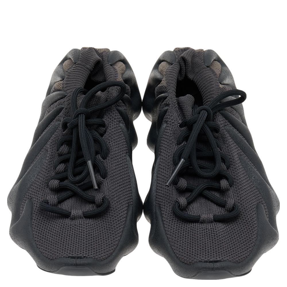 Designed by the famous collaboration Yeezy x Adidas, these 450 Dark Slate sneakers are everything you need to look sporty. They are crafted using black knit fabric with lace-up details on the vamps. Their fabric-lined insoles and fabric lining