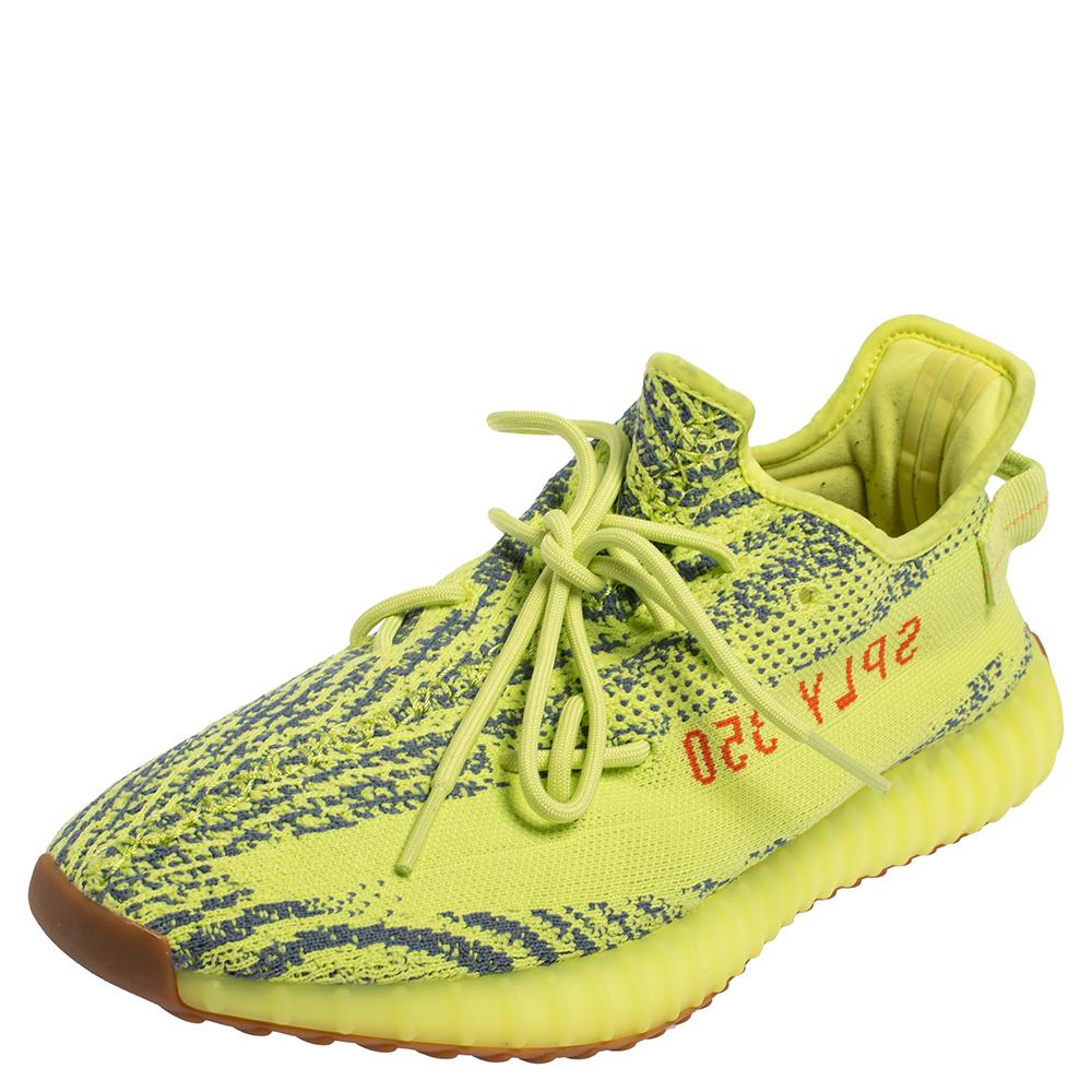 Catch on with the trend of designs from the Yeezy x Adidas collaboration with this pair of Boost 350 V2 Zebra sneakers. The knit fabric pair features great cushioning, lace-ups on the vamps, and tubular rubber soles. This pair comes with the