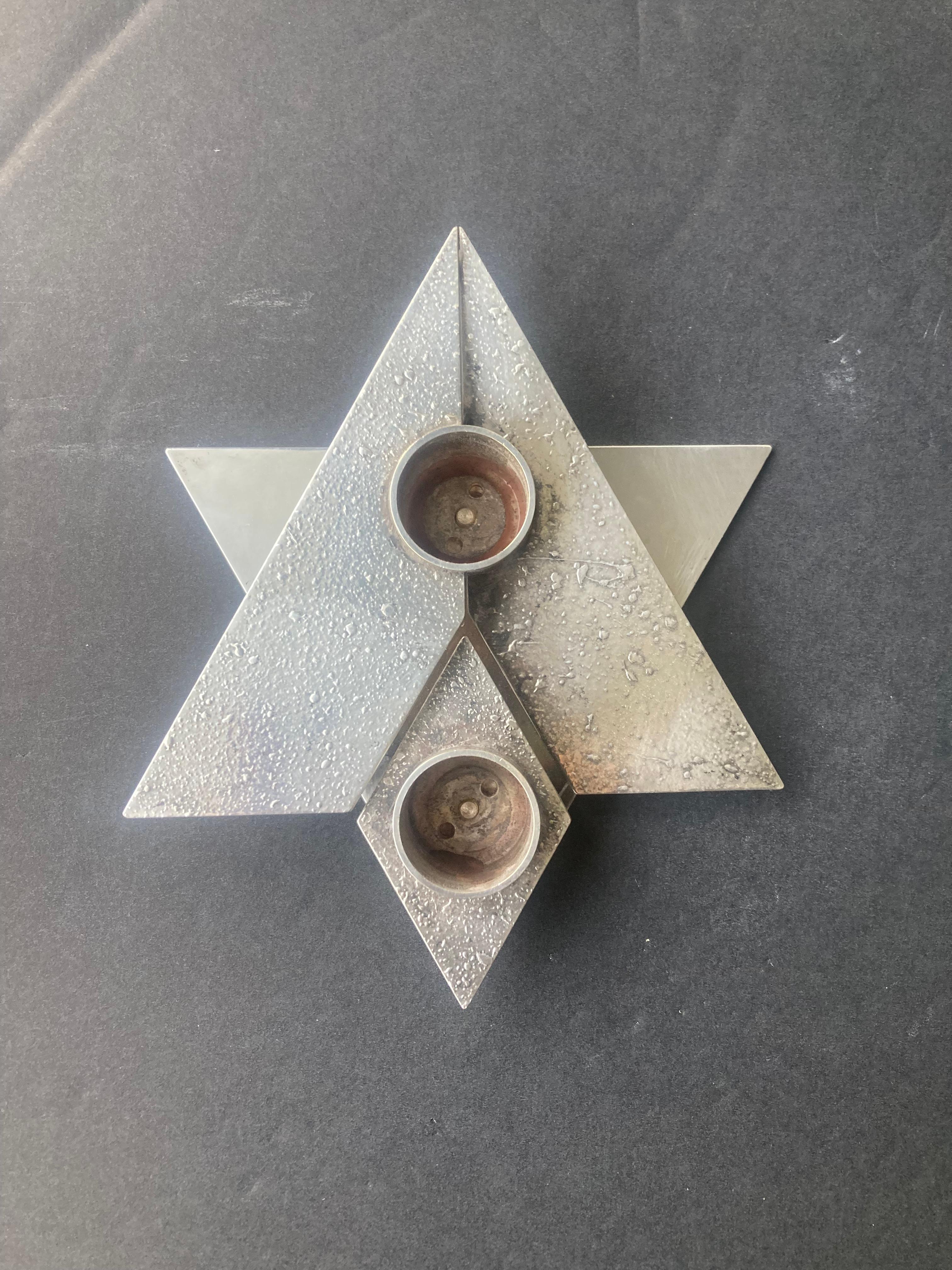 Very nice candleholder by the very well known silversmith and jeweler Yehia Yemini ( Yihye Yemini, 1896-1983) Bezalel School Jerusalem .This candleholder made in Star of David shape and some kind of antique finish surface in the 1980's just before