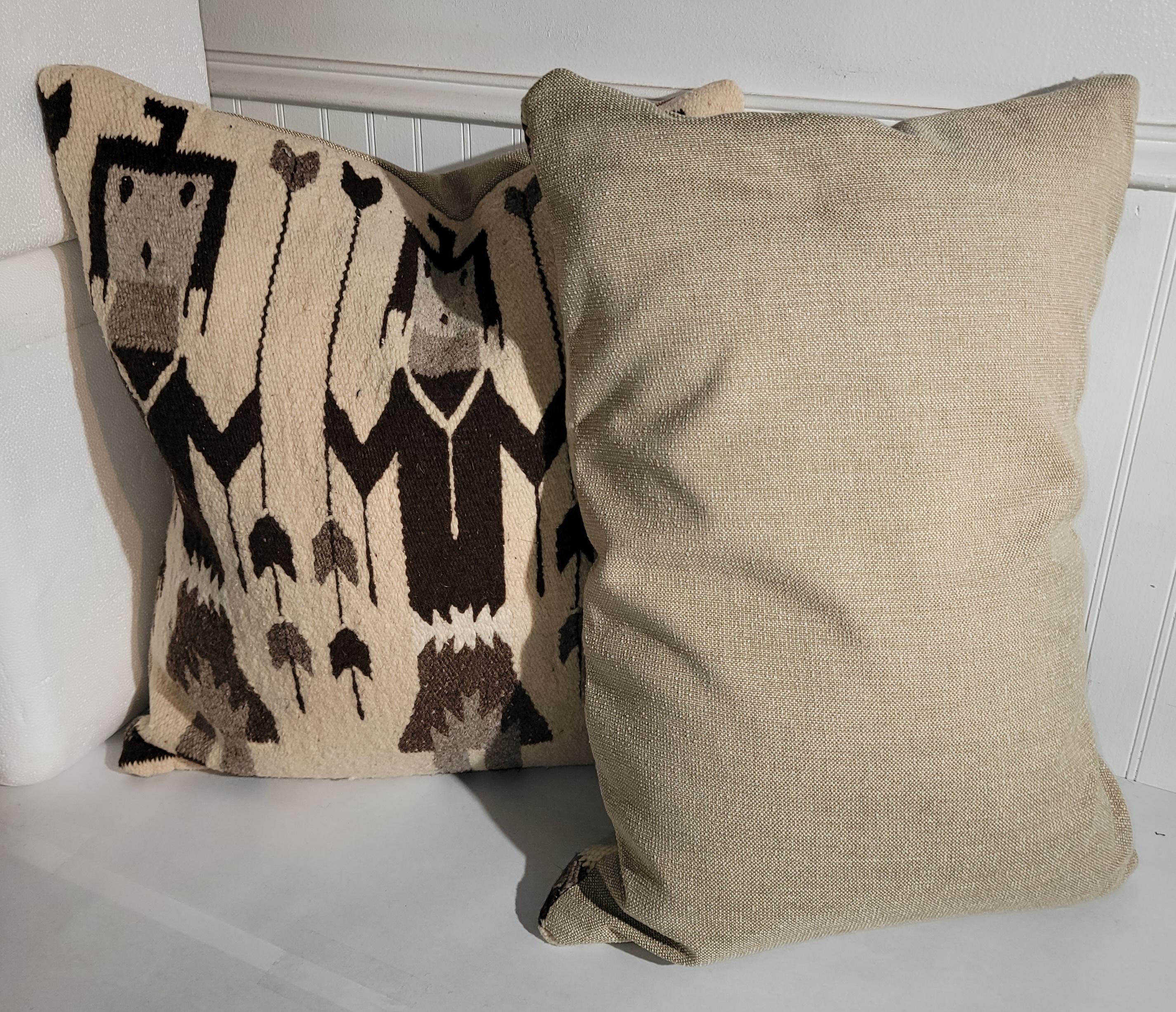 These Yei Indian weaving pillows are in fine condition and have linen backings.The inserts are down & feather fill.Sold as a matched pair.

Larger pillow measures 23 x 12
smaller pillow measures 23 x 16.