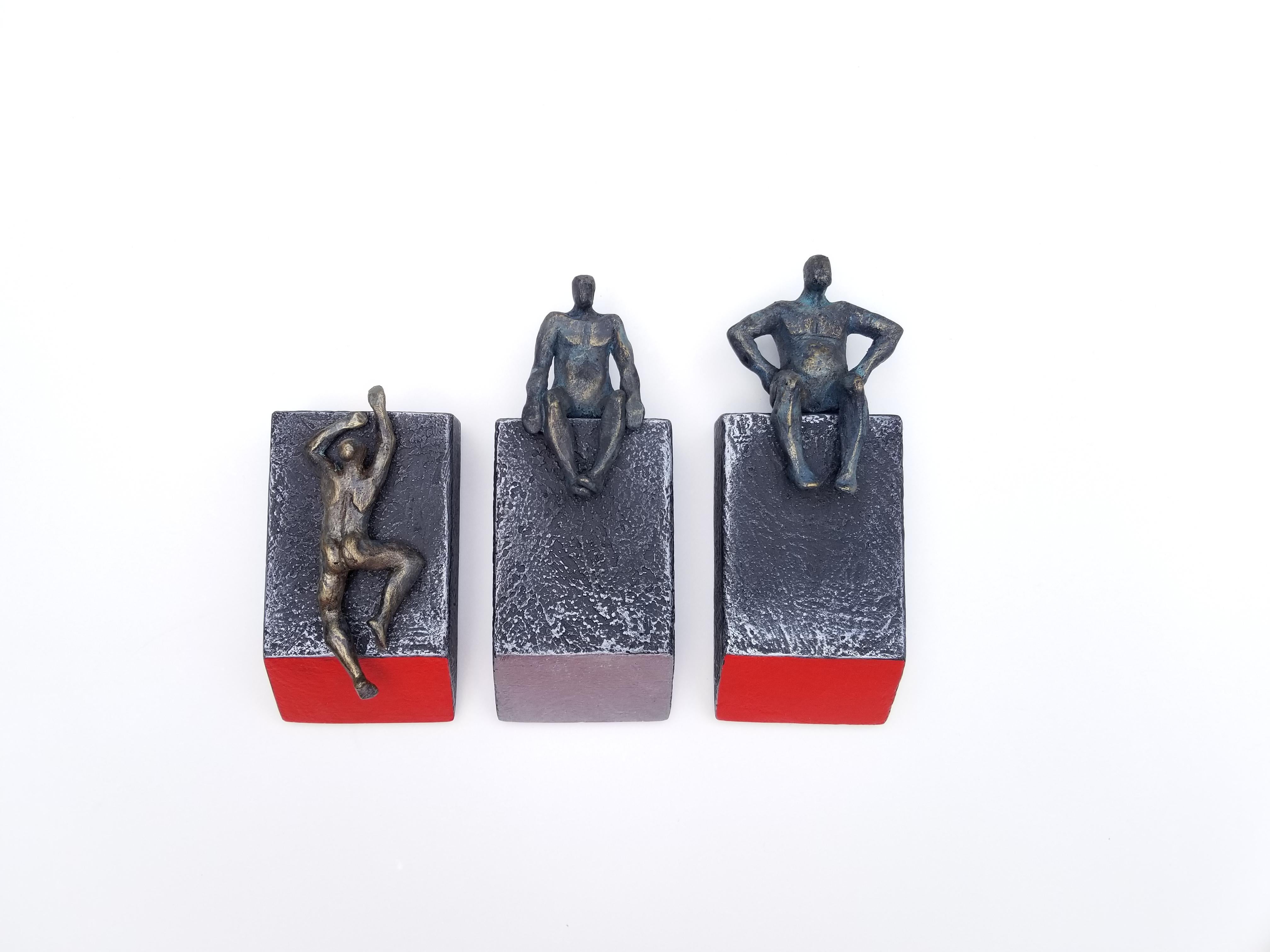 <p>Artist Comments<br>Unifying minimalist and modern styles, artist Yelitza Diaz builds a figurative sculpture of three figures settled on geometric pedestals. She manipulates the wooden elements to give it the roughness and apparent strength of