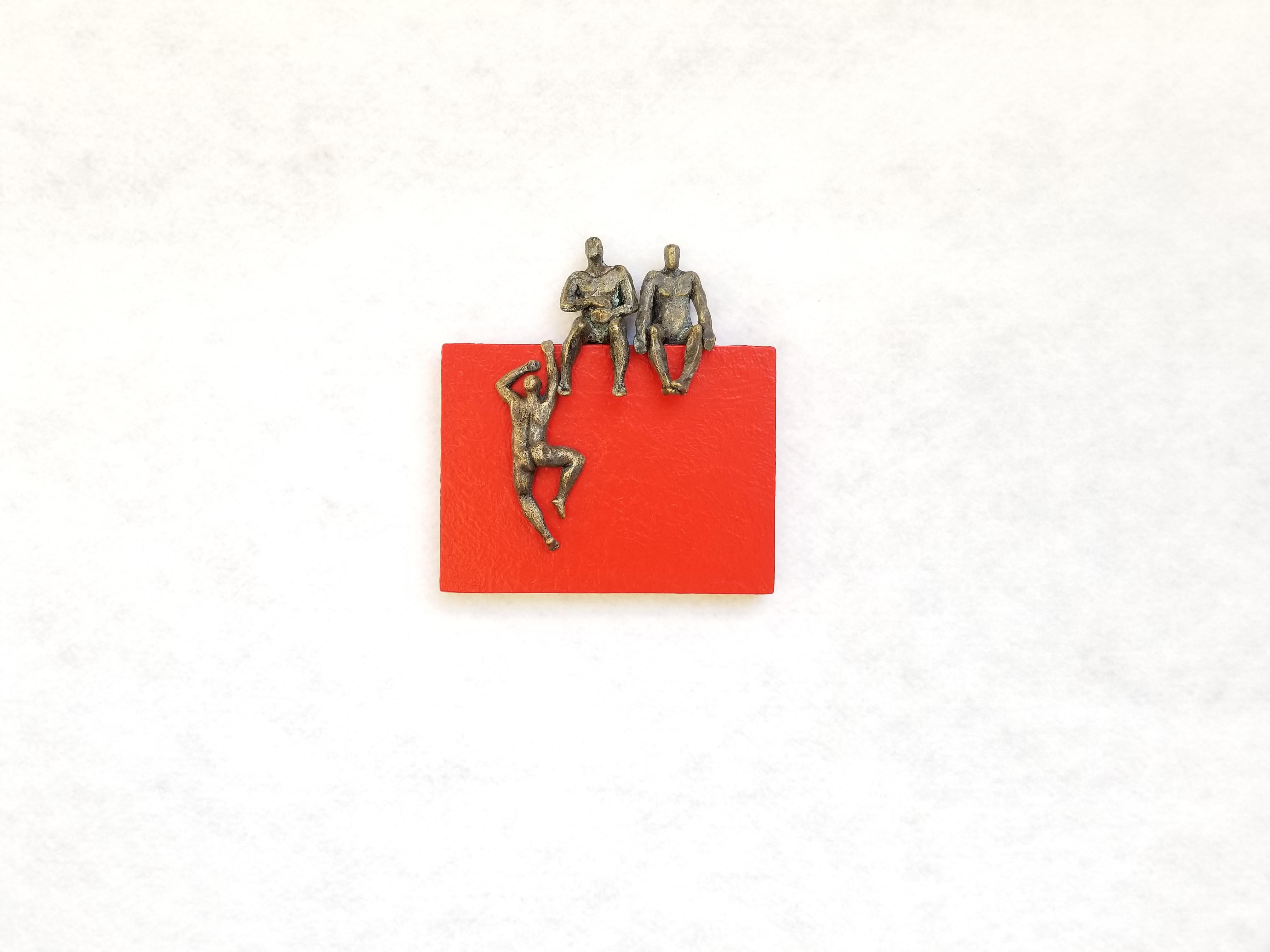 <p>Artist Comments<br>Two figures sit and wait for their companion climbing the ledge of a red rectangular structure. Artist Yelitza Diaz seeks to question the basic idea of minimalism by adding the human form to the composition. An experimental