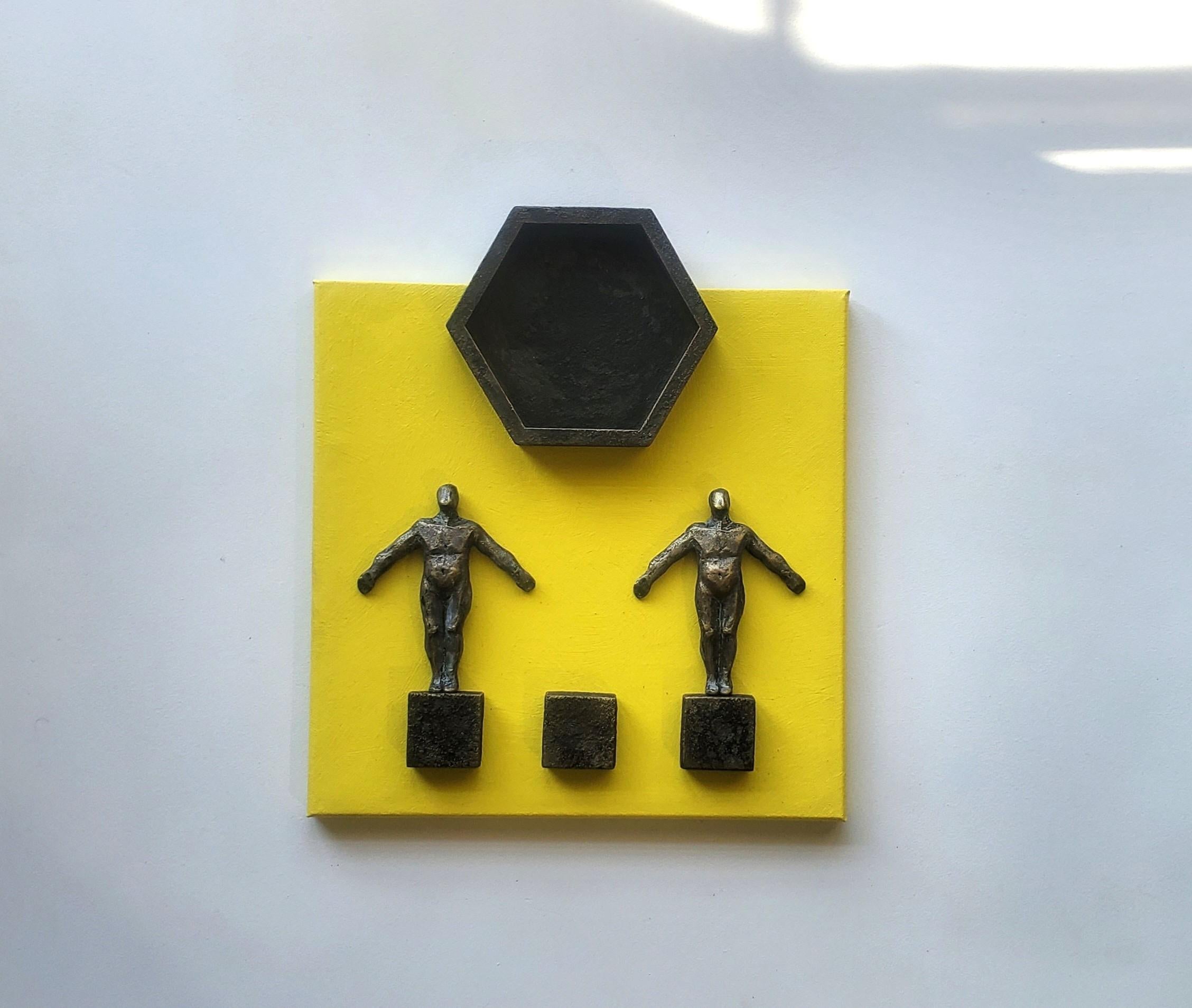 <p>Artist Comments<br />Three wooden bases support two figures, with a hexagon above them evoking the sun. They all symbolize perfect union, both on Earth and in the universe. The couple, made from resin and painted to resemble metal, unites in