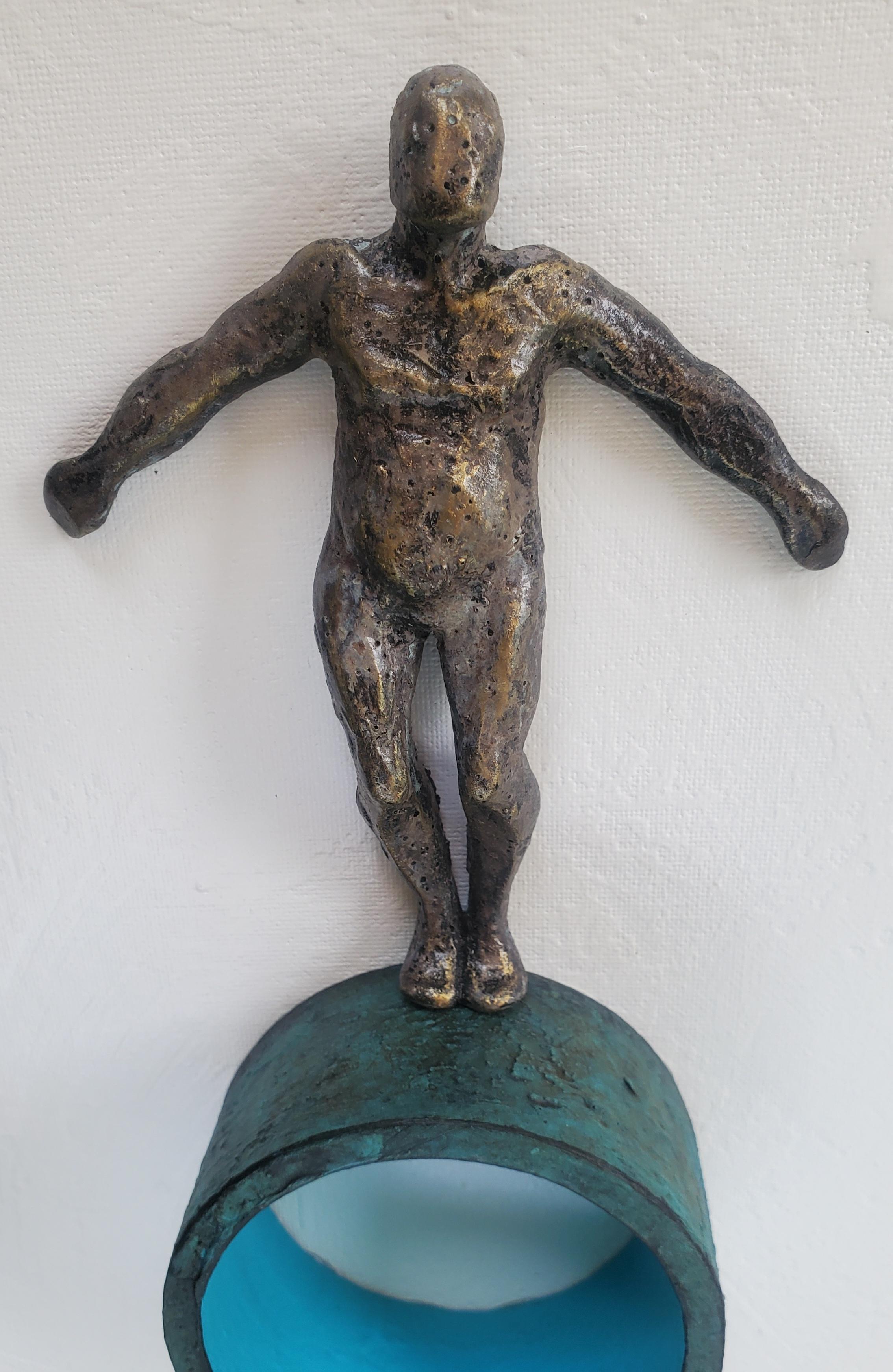 <p>Artist Comments<br>Artist Yelitza Diaz presents a bronze-painted figure balancing itself on a round structure encrusted in a patina-like texture. Inspired once again by minimalism, she considers the possibility of contradicting the style by
