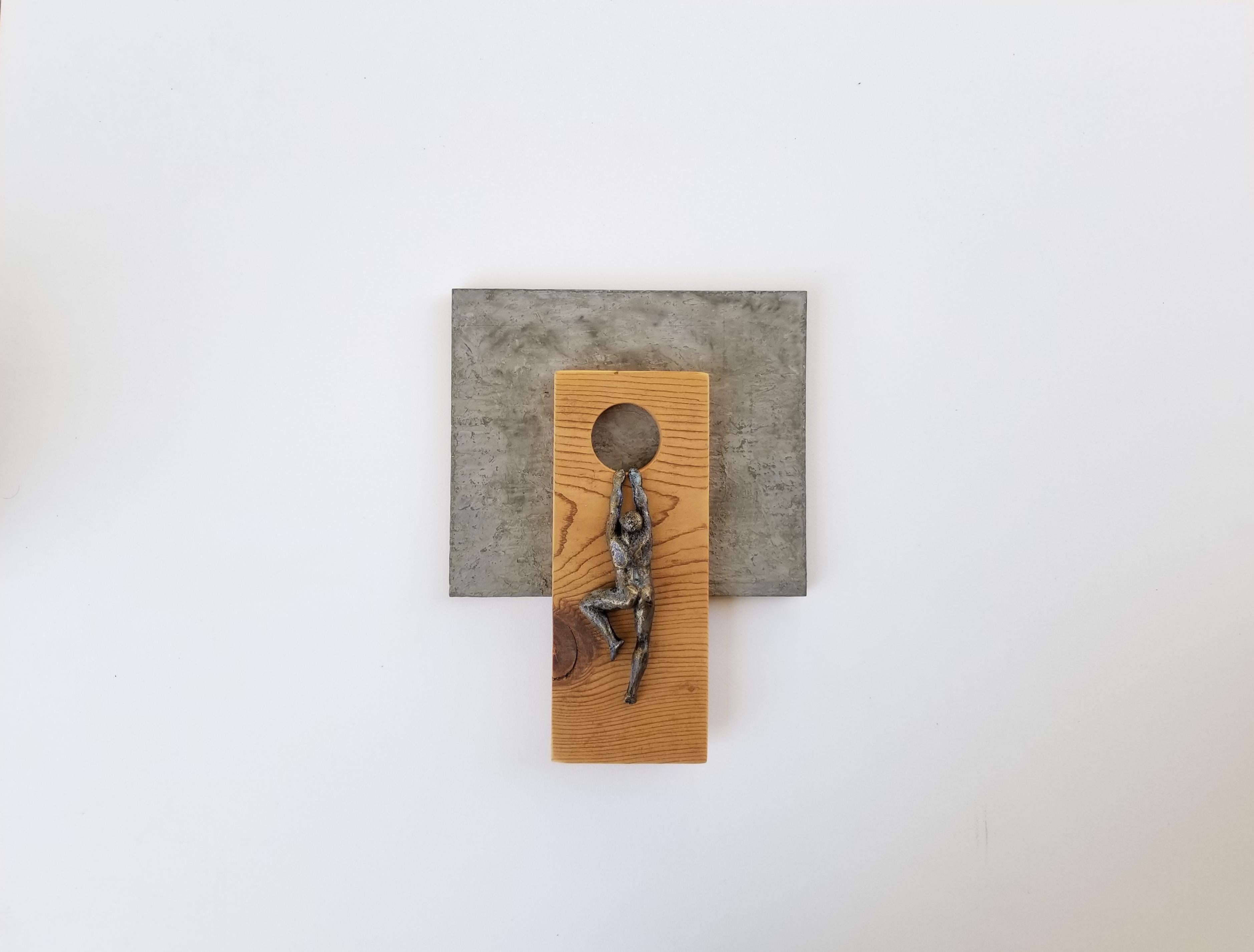 <p>Artist Comments<br>Artist Yelitza Diaz presents a nude figure hanging from a wooden module. Part of her Climbers series depicting people ascending geometric wooden cutouts. Yelitza offers the piece with neutral colors and virgin wood for a