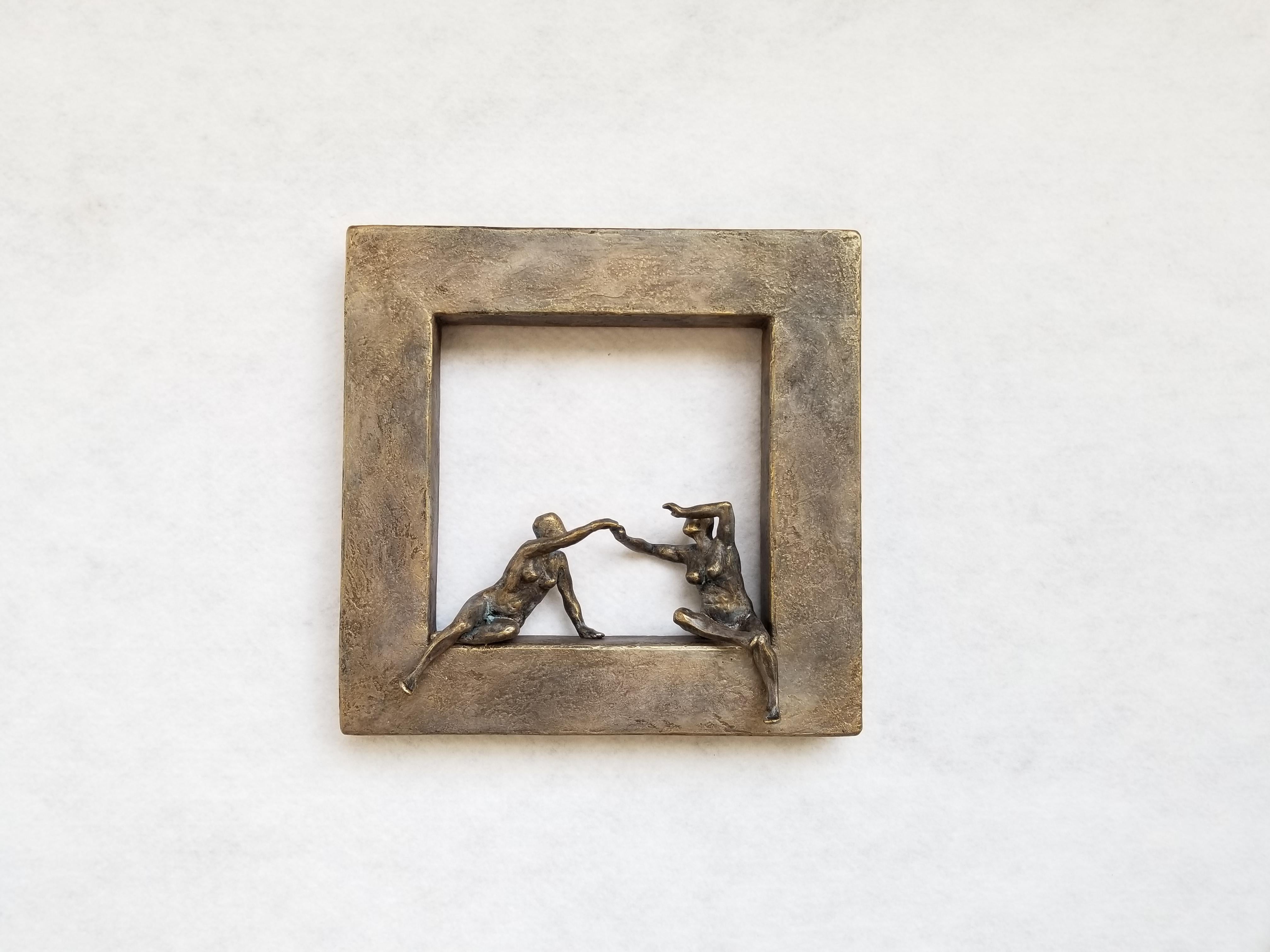 <p>Artist Comments<br>Artist Yelitza Diaz demonstrates two nude female figures trying to connect on a geometric window coated in classic bronze. She seeks to question the basic idea of minimalism by adding the human form to the compositionâ€”a