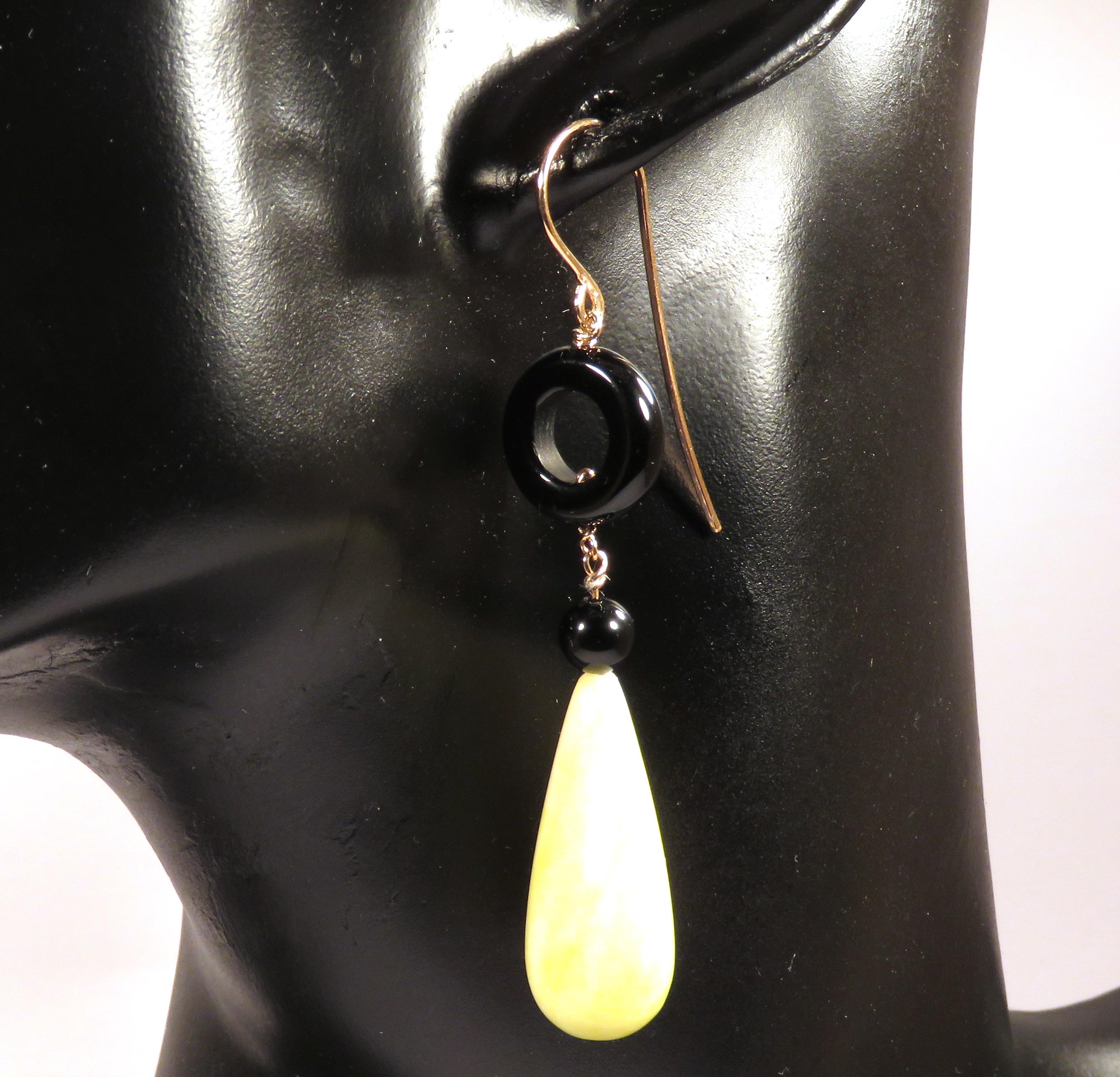 Beautiful dangle earrings in 9 karat rose gold with real yellow agate drops and onyx. The length of each earring is 70 mm / 2.755 inches. Each item is stamped with the Italian gold mark 375 and Botta Gioielli brandmark