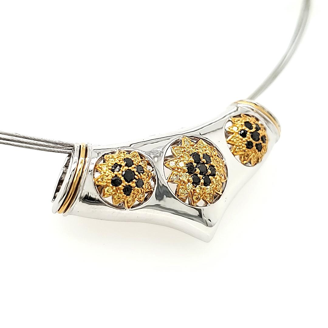The Yellow and Black Diamond Slider Pendant is a captivating piece featuring a trio of sun-shaped yellow diamonds adorned with a total of 21 small black diamonds, adding up to 0.40 carats. 

Each sun has seven black diamonds set in it, a unique