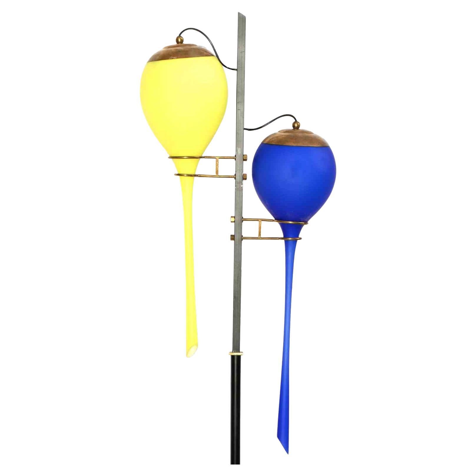 Yellow and Blue Stilnovo lamp is a design item realized in the mid-20th Century for Stilnovo.

Marble base, black painted metal stem, blue and yellow colored glass diffusers.

Very good condition.

Collect a design lamp!