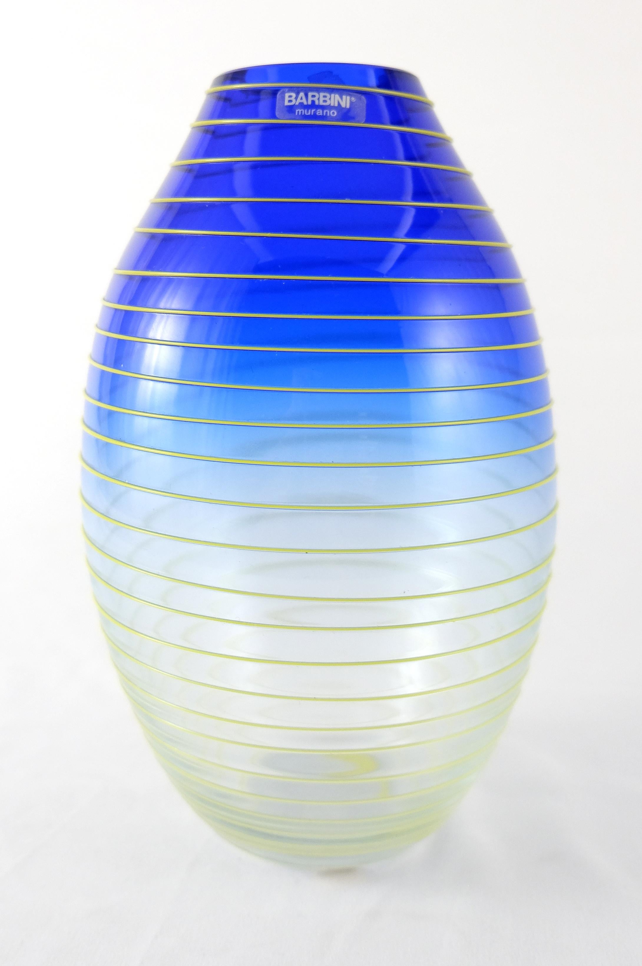 Barbini Murano Yellow and Blue Stripe Glass Vase Set

Offered for sale is a set of two yellow and blue stripe Murano glass vases. Each vase is signed on the base and still retains the original Barbini label. The measurements given below are for the