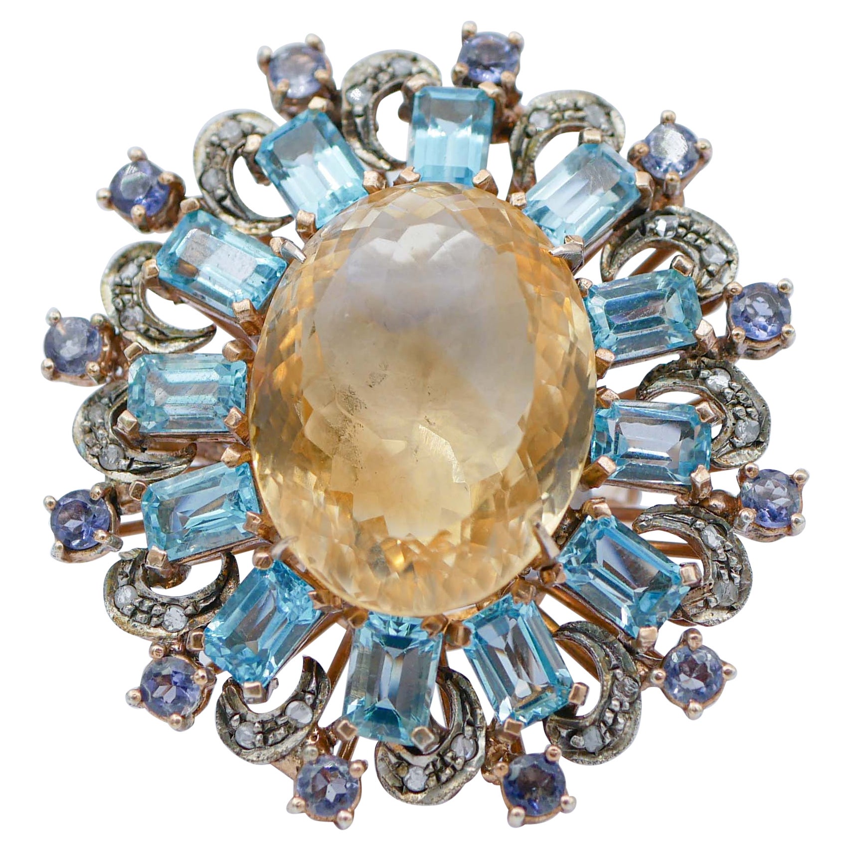 Anello con topazi gialli e blu, tanzanite, diamanti, oro rosa e argento.