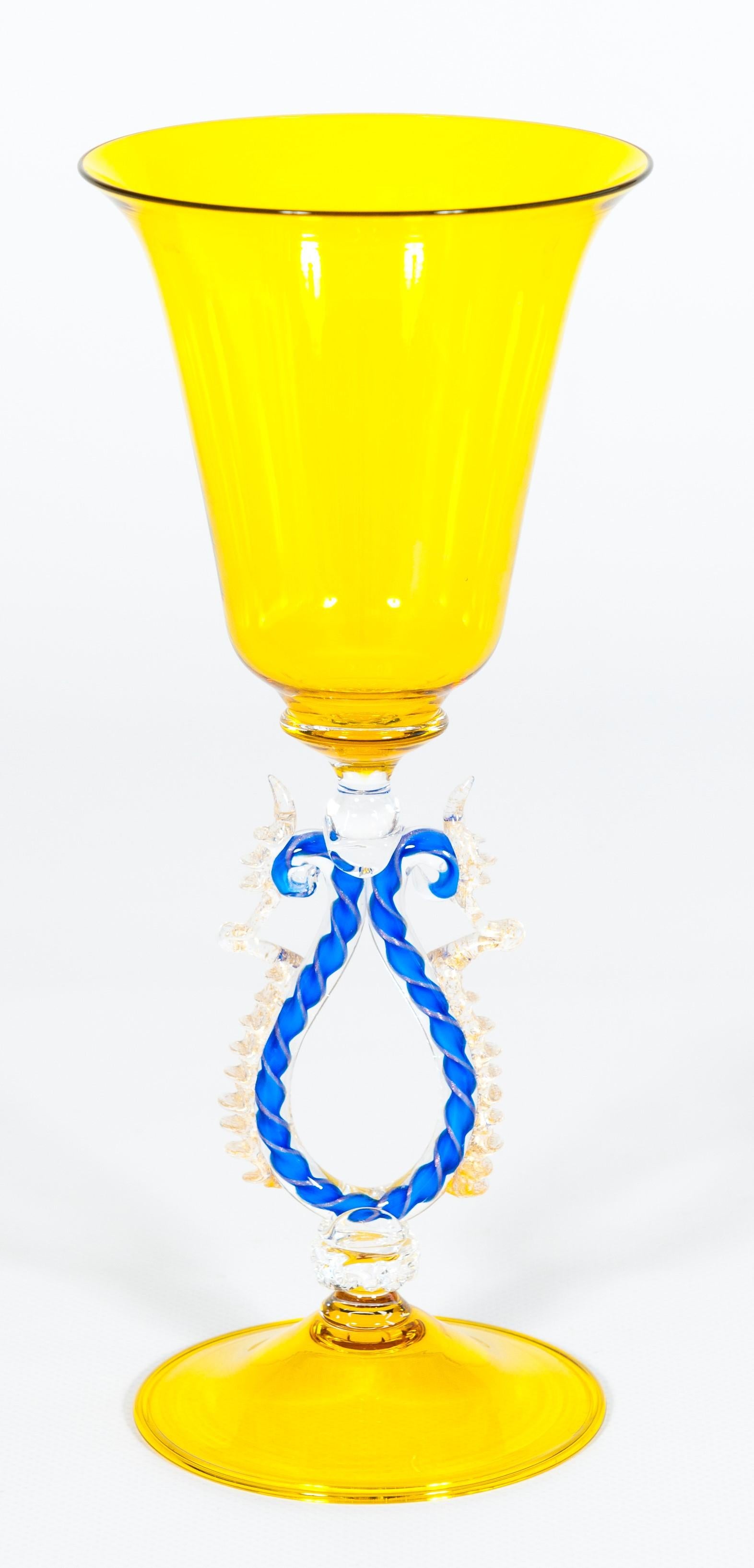 Yellow and blue Venetian goblet with gold finishes in Murano glass, Italy, 1990s
This outstanding goblet is a fine example of the Murano glassblowing tradition. Its bright yellow and blue colors, with gold finishes, emanate and air of elegance, and