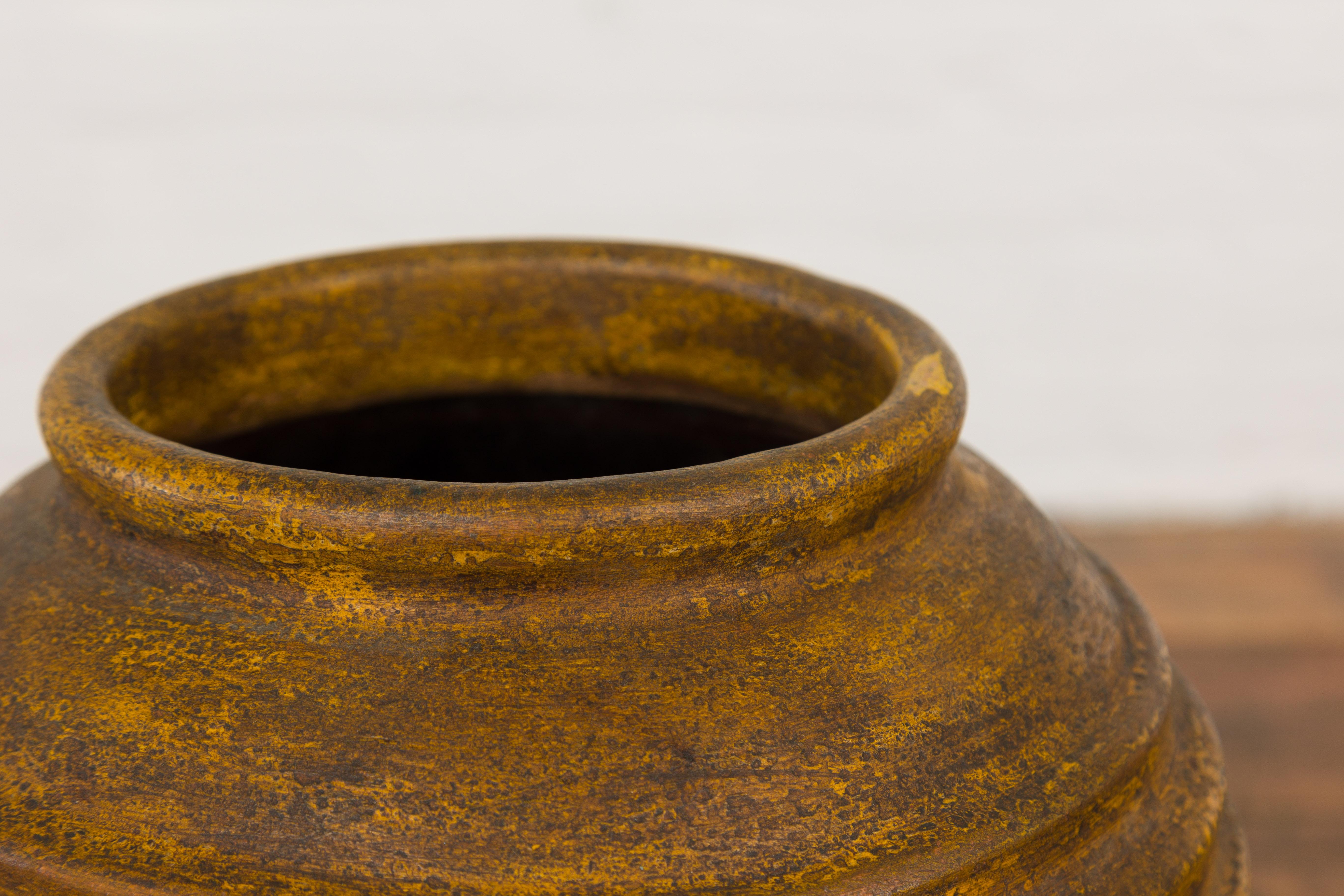 Yellow and Brown Storage Vase with Concentric Design and Rustic Character 6