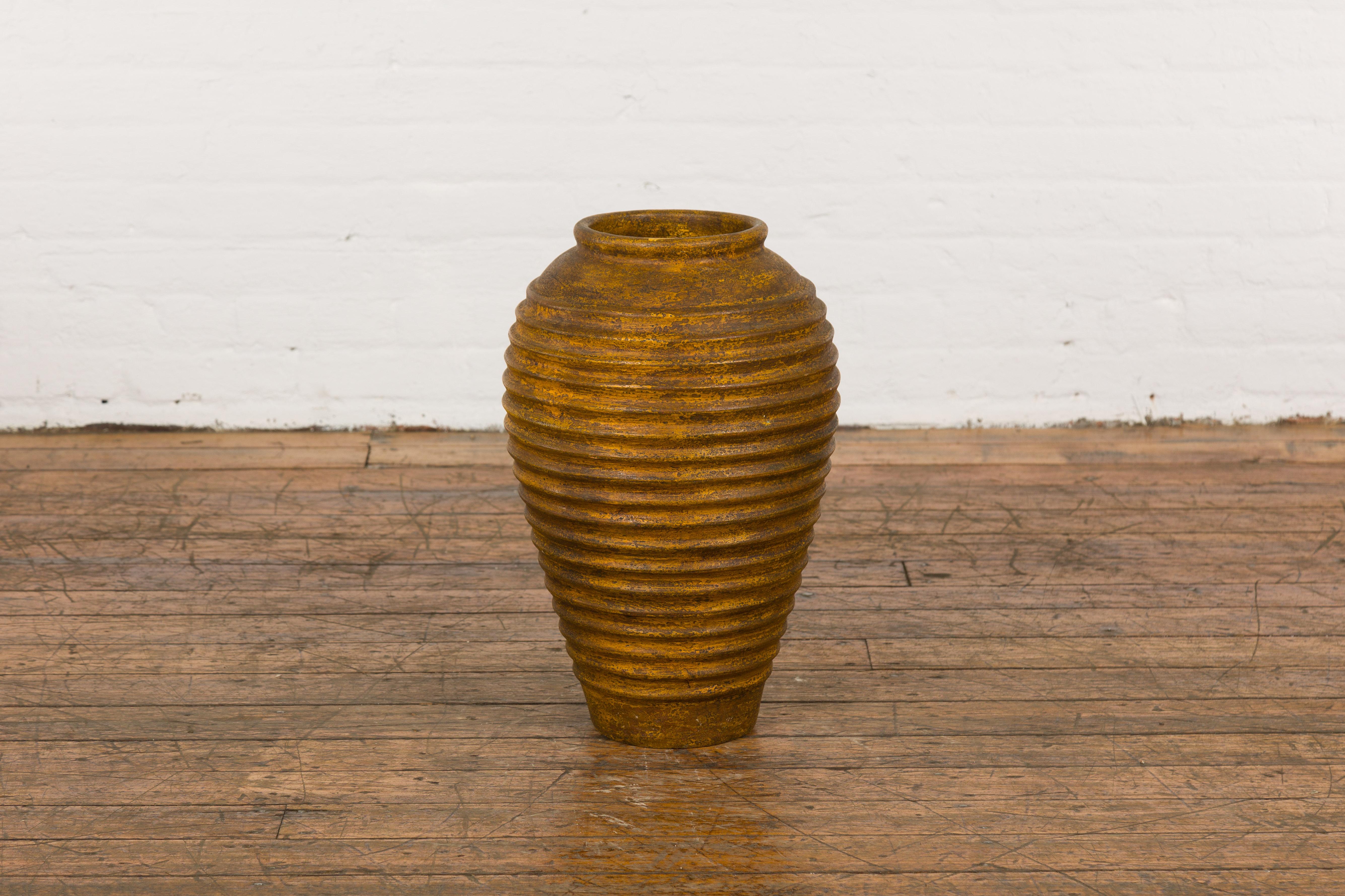Yellow and Brown Storage Vase with Concentric Design and Rustic Character 10