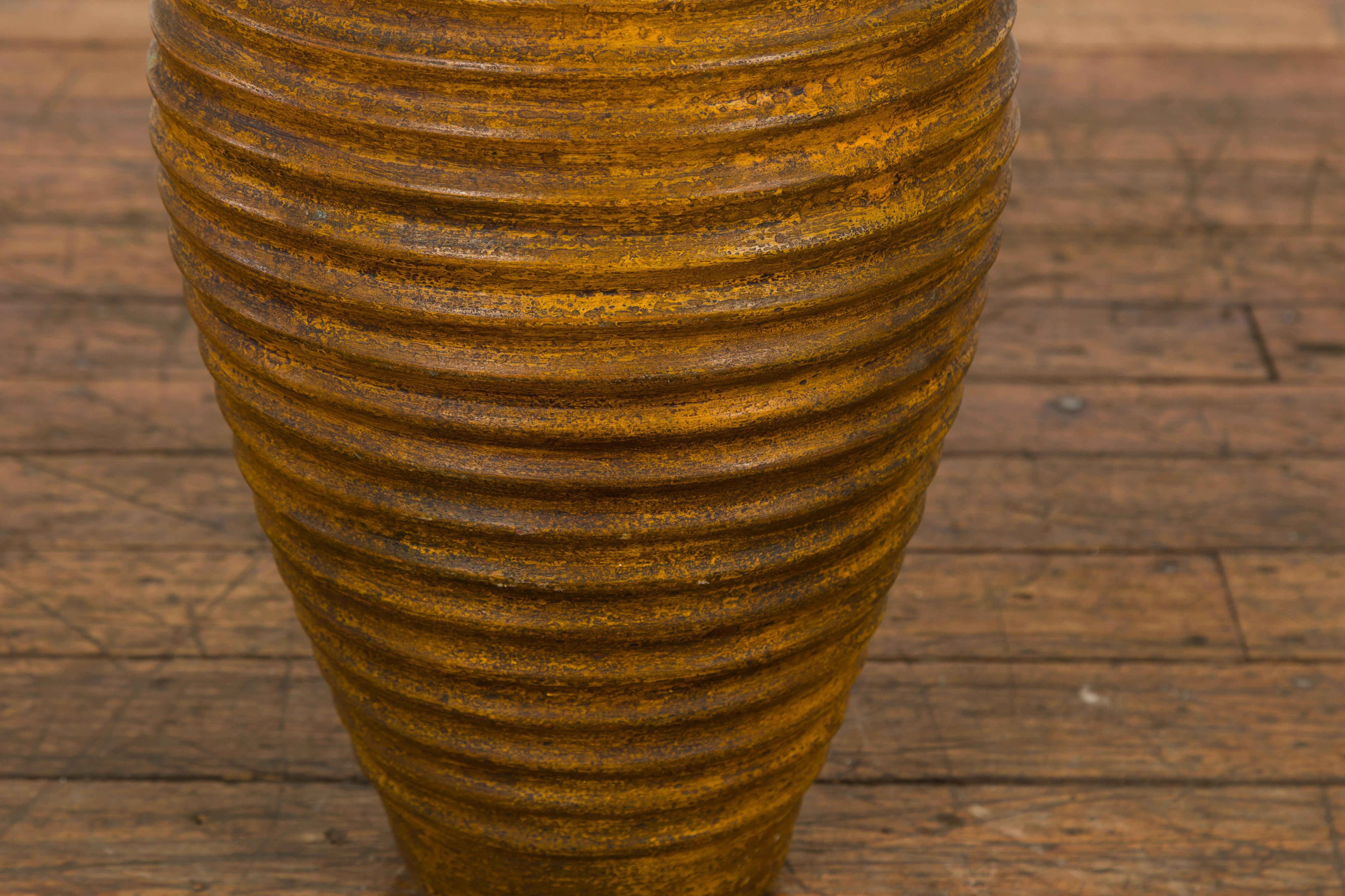 Yellow and Brown Storage Vase with Concentric Design and Rustic Character 1