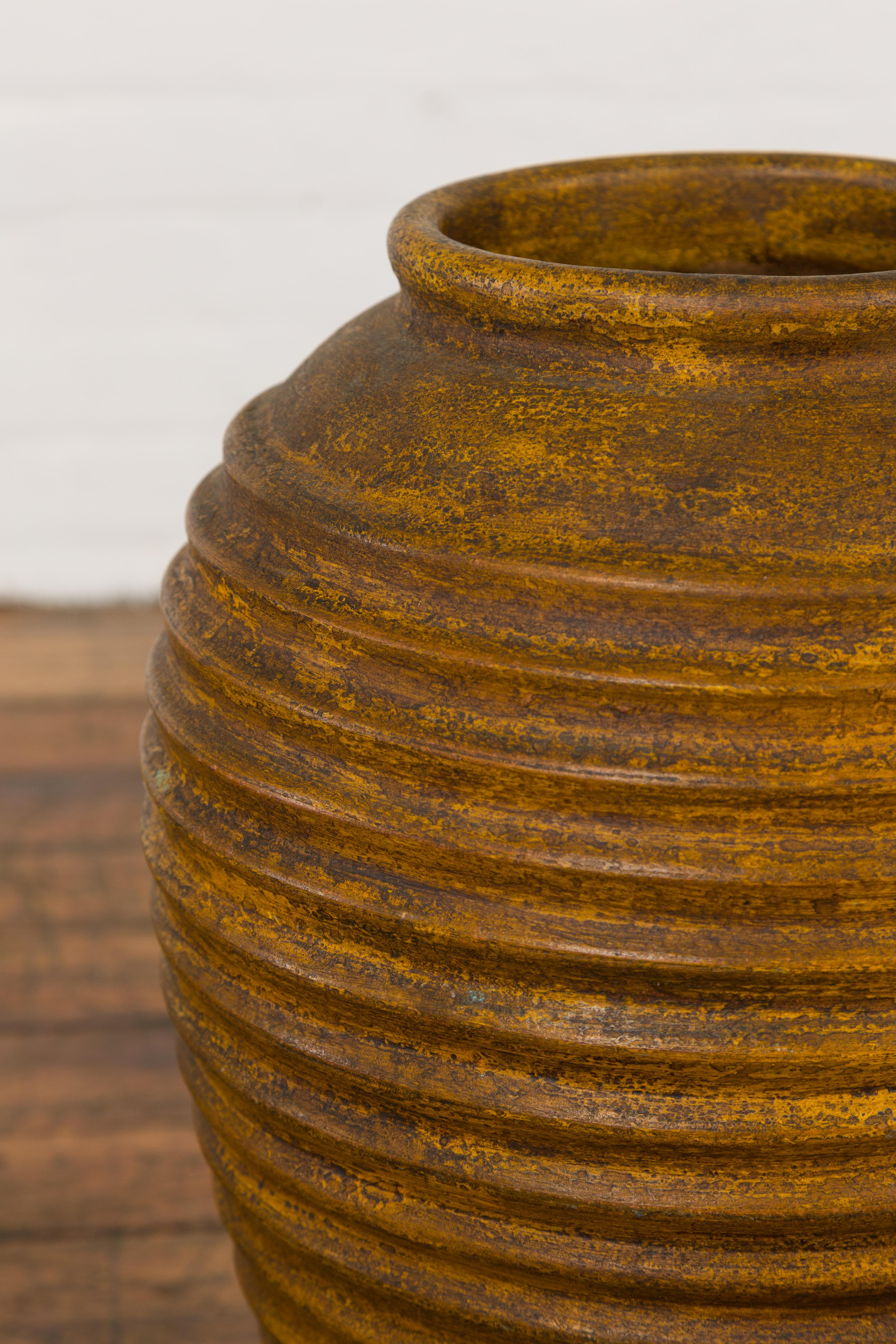 Yellow and Brown Storage Vase with Concentric Design and Rustic Character 3