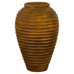 Yellow and Brown Storage Vase with Concentric Design and Rustic Character