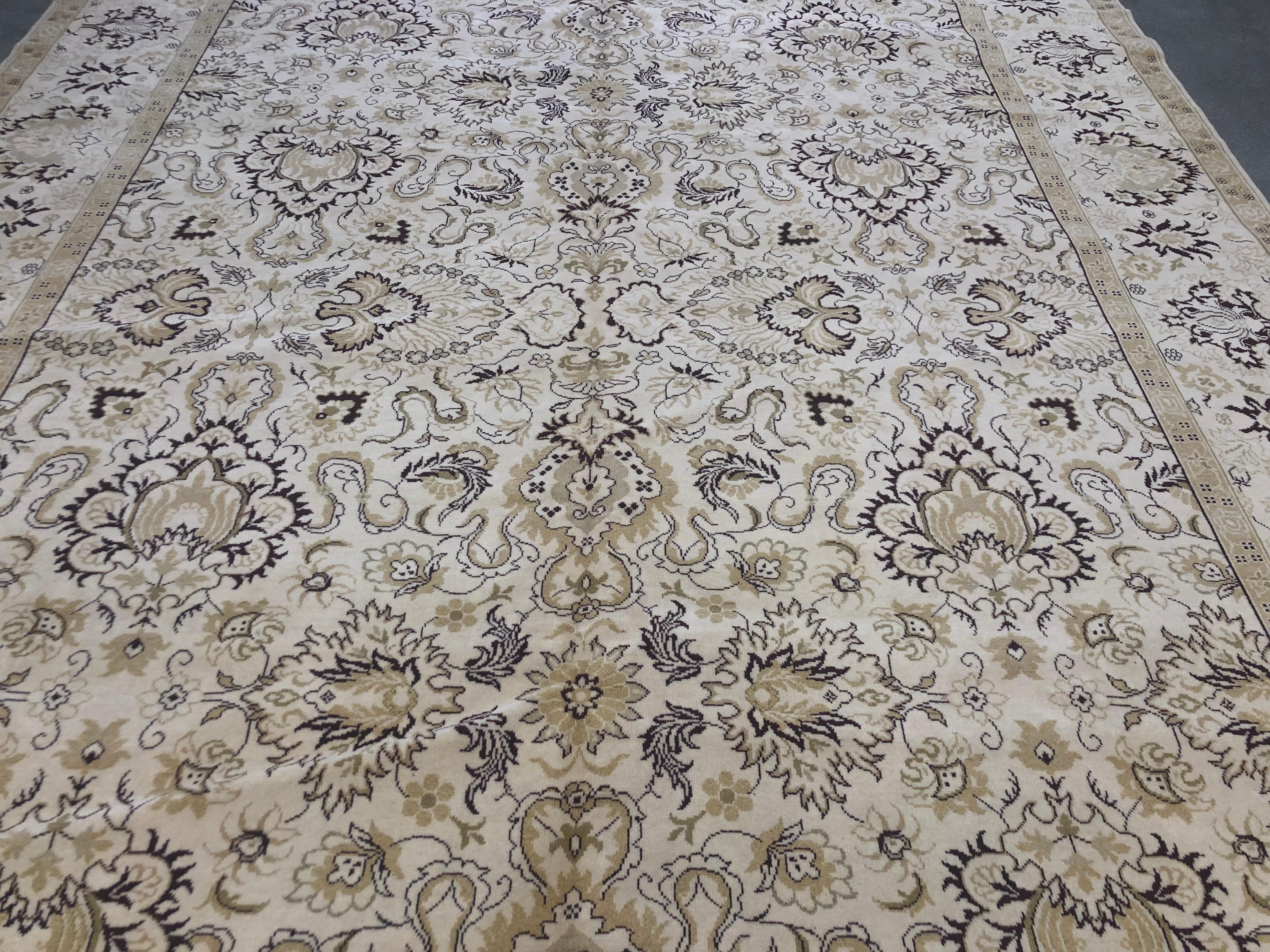 Light and dark have been woven together in a wonderfully intricate way in this floral pattern rug. Yellow, gold and claret. Hand knotted wool.