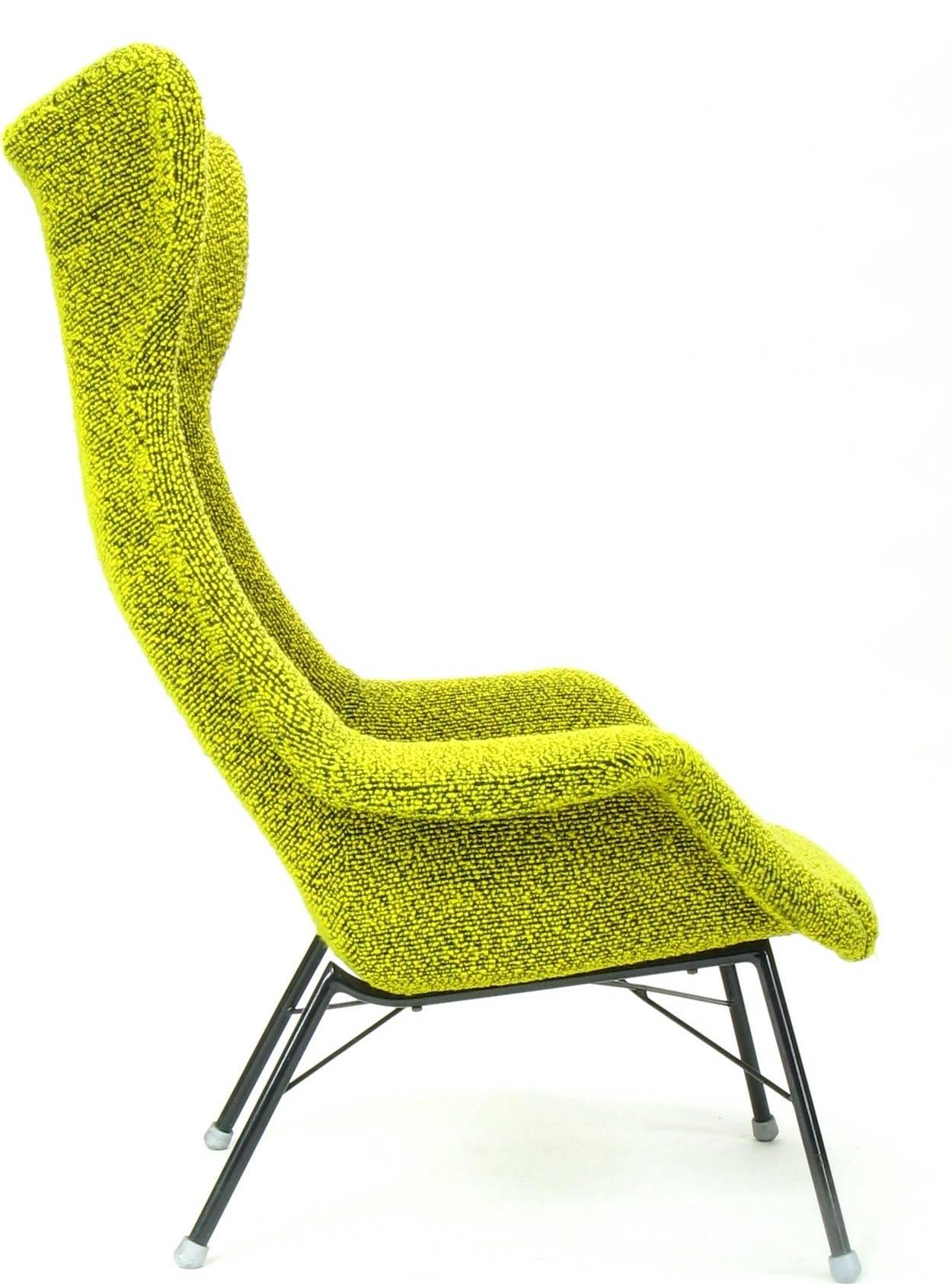 Wingback armchair designed by Miroslav Navratil.
Produced by TON in Bystrice in the 1960s.
The original yellow/green material (sheep's wool boucle) was cleaned and is in excellent condition. 
The item may have the original patina or traces of use