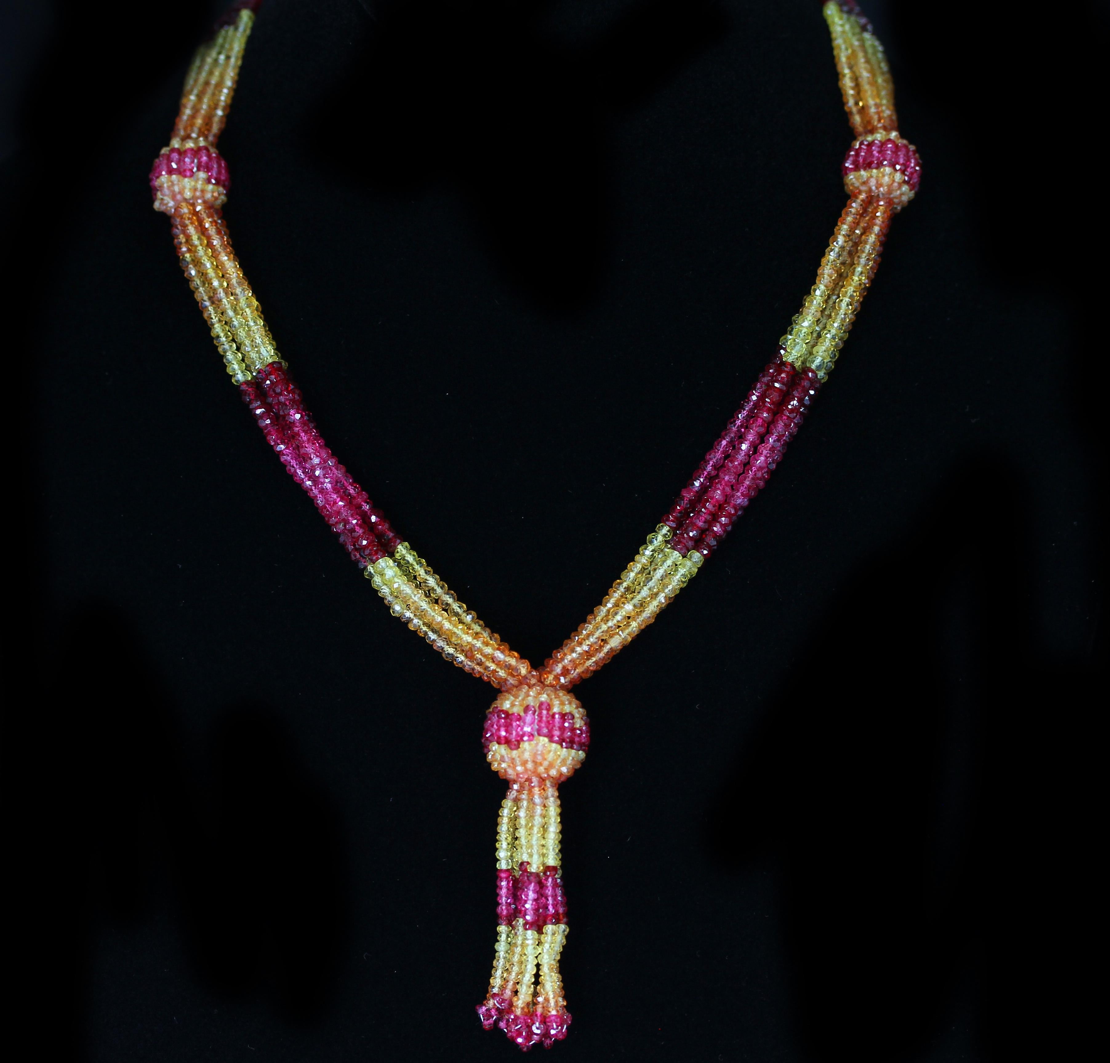 A beautiful tassel necklace with shaded Faceted Yellow and Orange Sapphire Beads with Spinel, with an 18K Yellow Gold Clasp with Diamonds. Weight: 315 cts. Necklace/Earring Set: Matching earrings available.