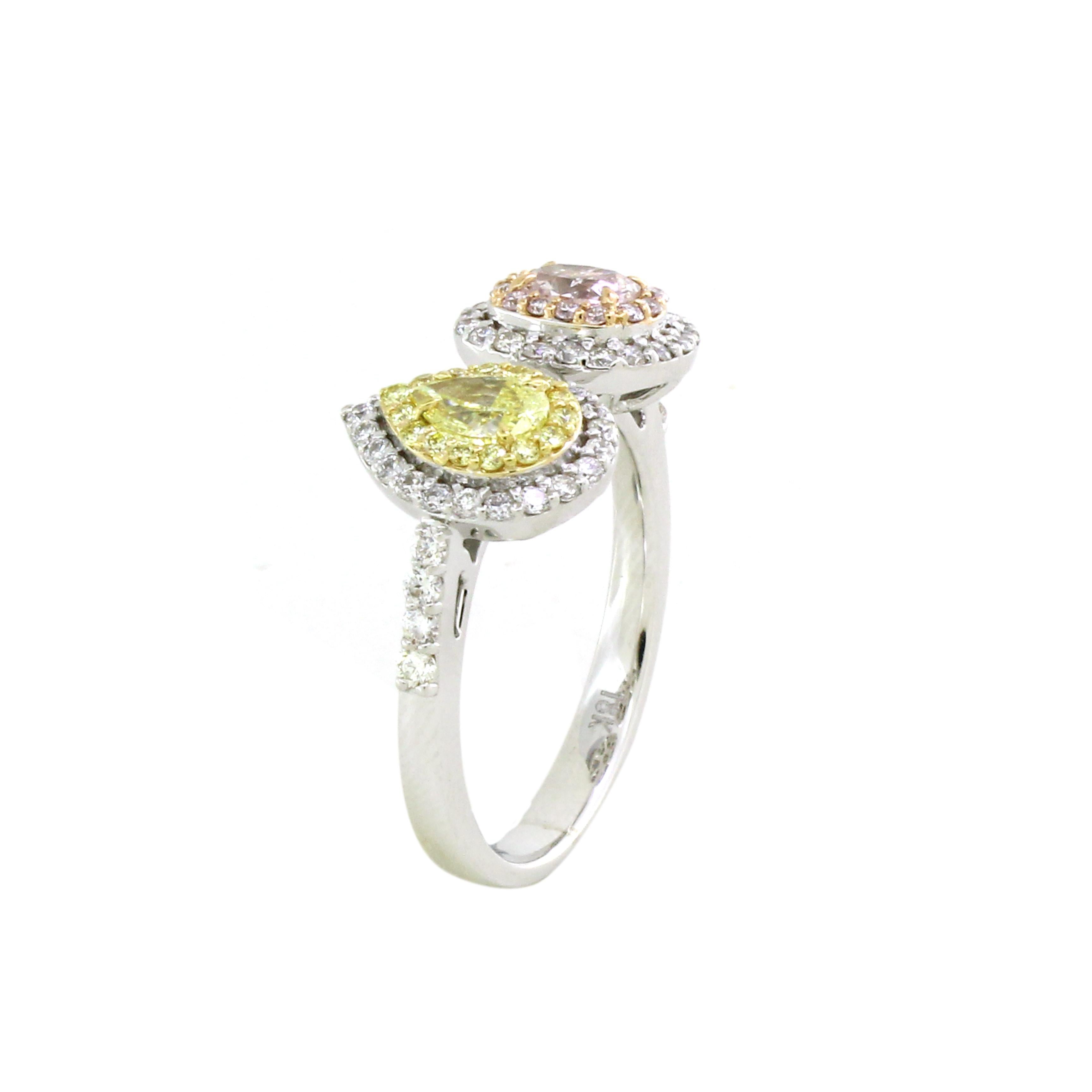 This Toi-et-Moi ring features a captivating dual-center design, where two distinct gemstones take center stage. 
The first centerpiece is a brilliant pear-shaped yellow diamond, weighing 0.3 carats. The pear-shaped cut exudes grace and timelessness,