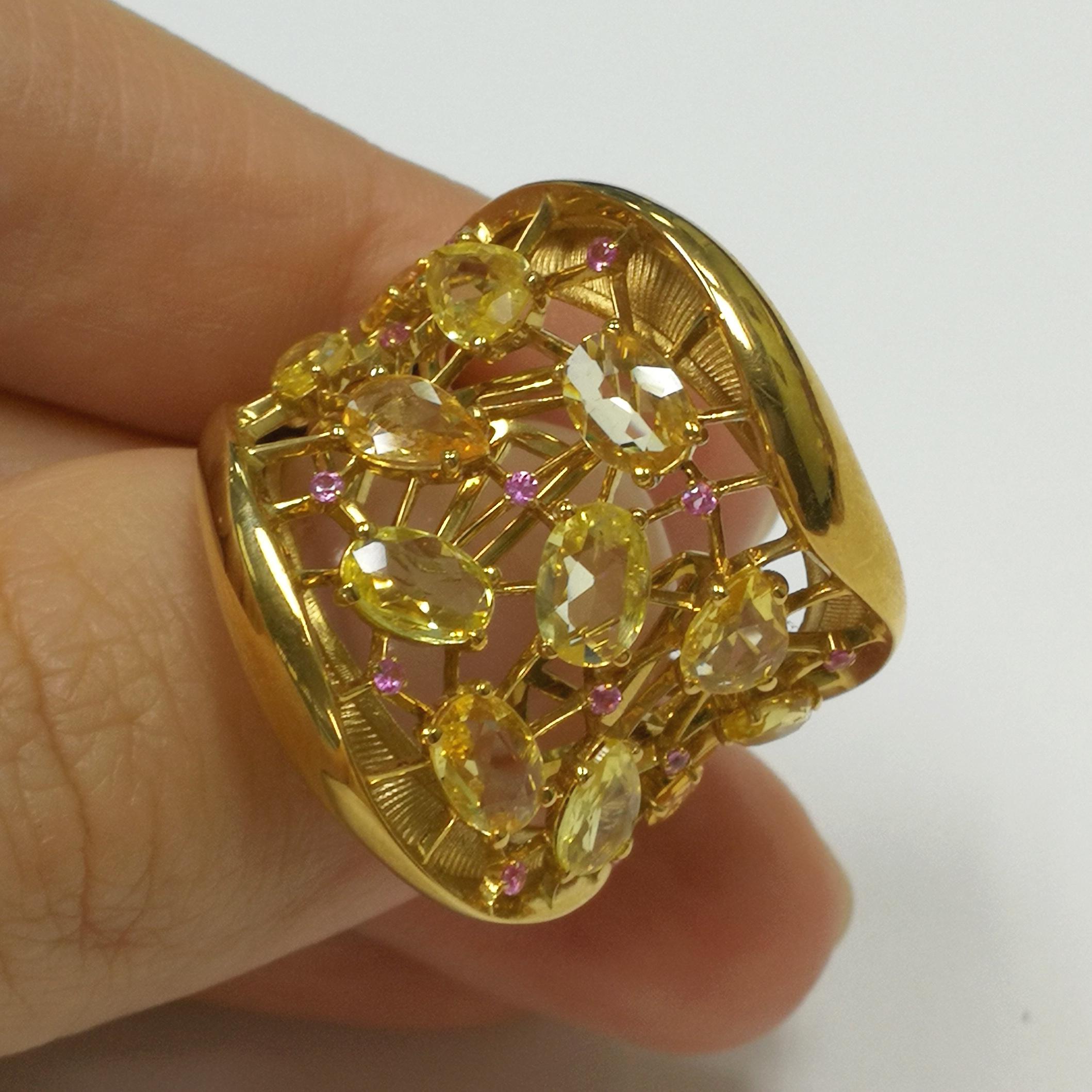 Yellow and Pink Sapphires 18 Karat Yellow Gold Splash Ring
As a sunbeam from darkness bursts into your hearts, this bright Ring! The middle of the Ring, made of 18 Karat Yellow Gold, resembles a plexus of thin strings, like a small cobweb into which