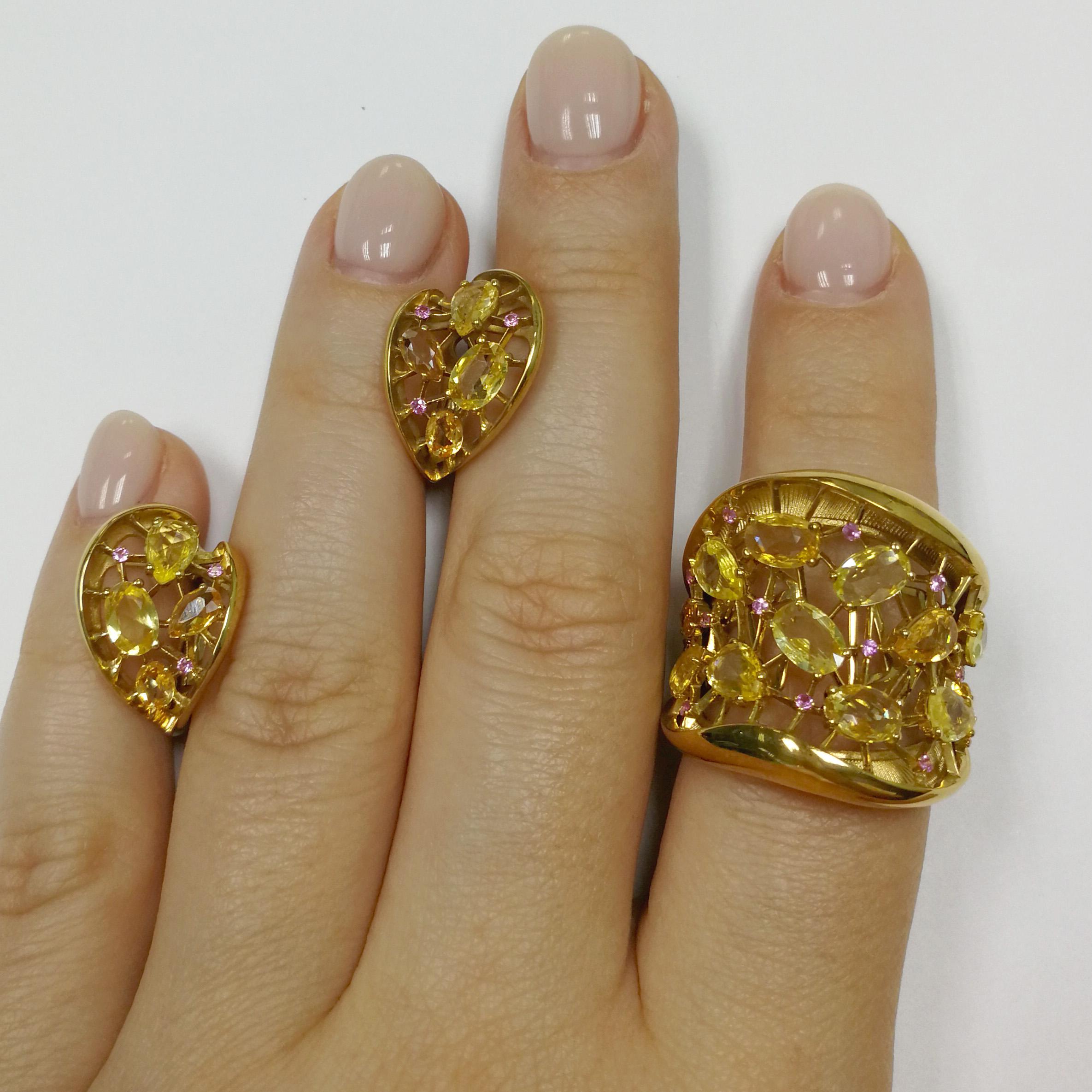 Yellow and Pink Sapphires 18 Karat Yellow Gold Splash Suite
As a sunbeam from darkness bursts into your hearts, this bright Suite! The middle of the Ring and Earrings, made of 18 Karat Yellow Gold, resembles a plexus of thin strings, like a small