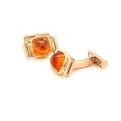 Manschettenknöpfe aus Gelb- und Roségold mit Spessartit und orangefarbenem Granat
