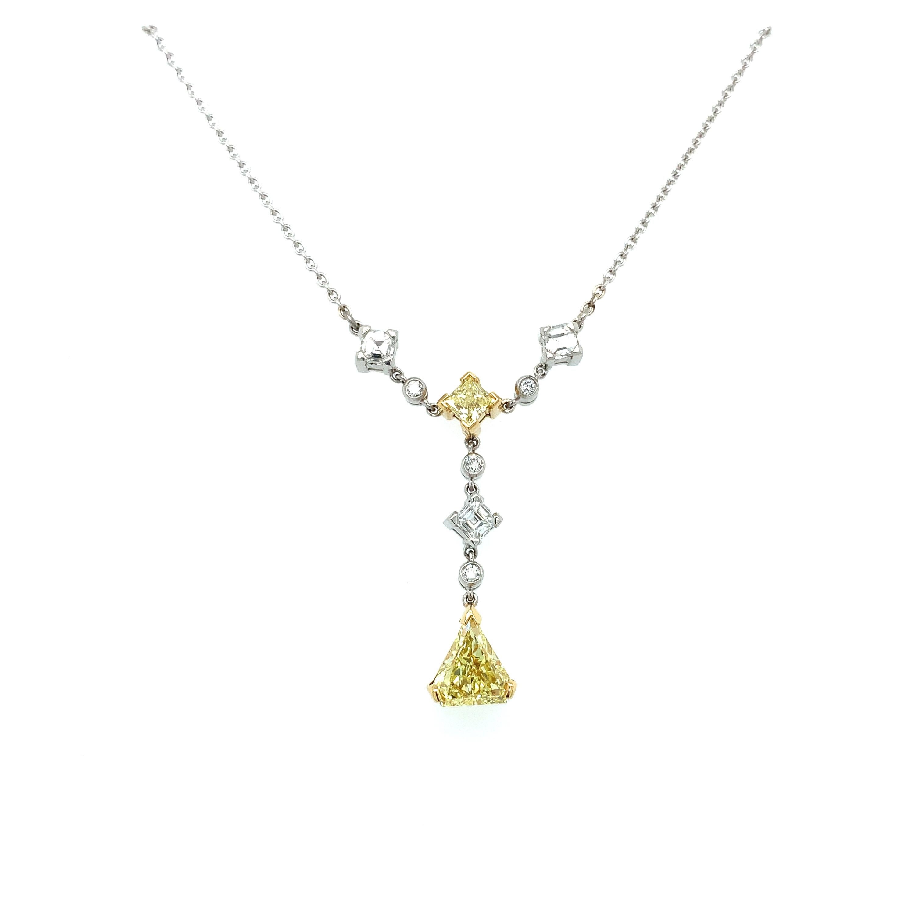 Yellow and white diamonds drop art-deco necklace 18k white gold
Composed of fancy intense yellow diamond centre trillion pentagon cut modified IGI certified diamond total weight 0.85ct, additional diamond yellow diamond princess cut and