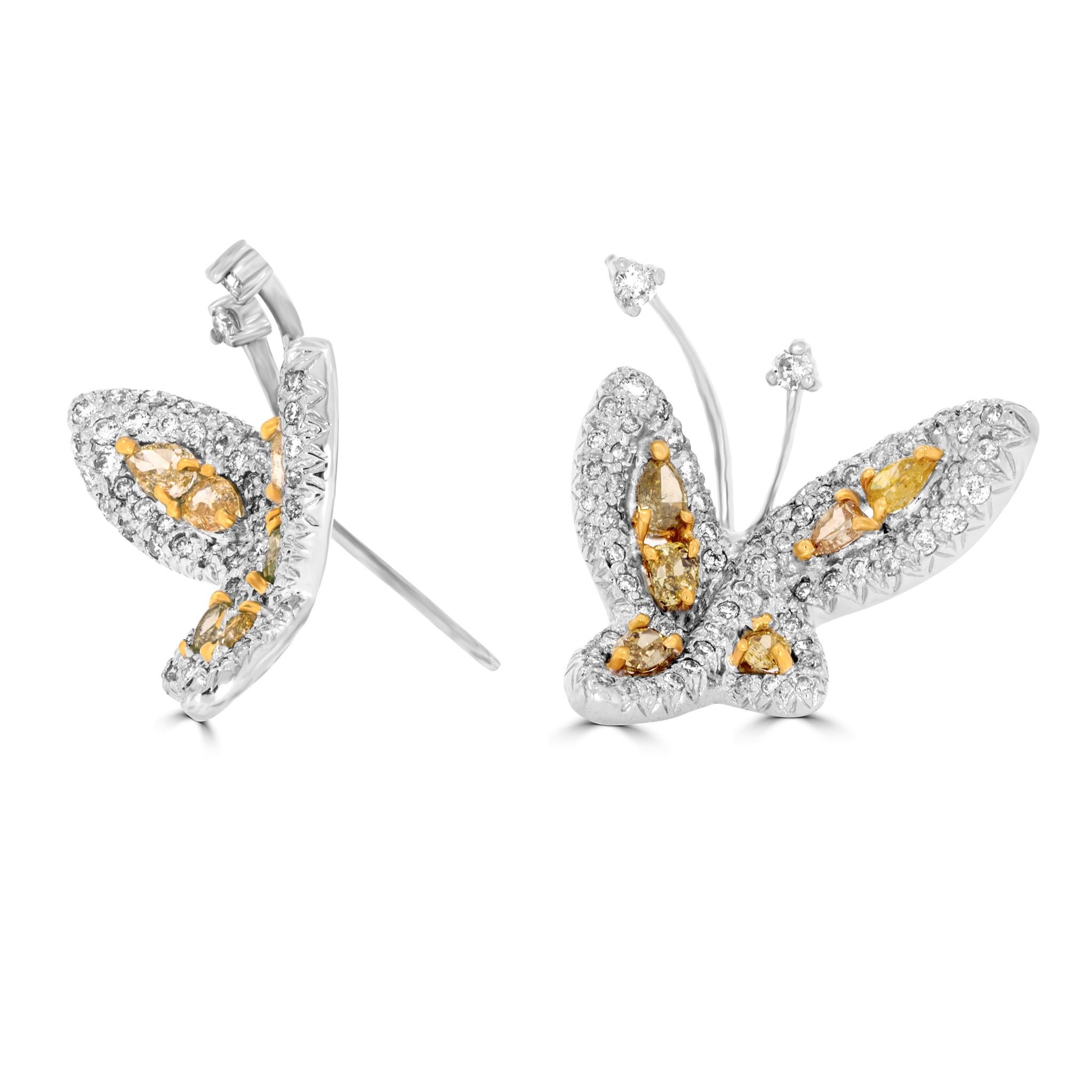 Flutter into elegance with these exquisite butterfly earrings from bo•be jewelry. Crafted in lustrous 18 carat white and yellowgold, these winged wonders showcase a dazzling dance of yellow and white diamonds. Fancy cut and coloured diamonds take