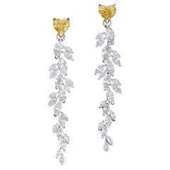 Boucles d'oreilles pendantes en diamant jaune et blanc