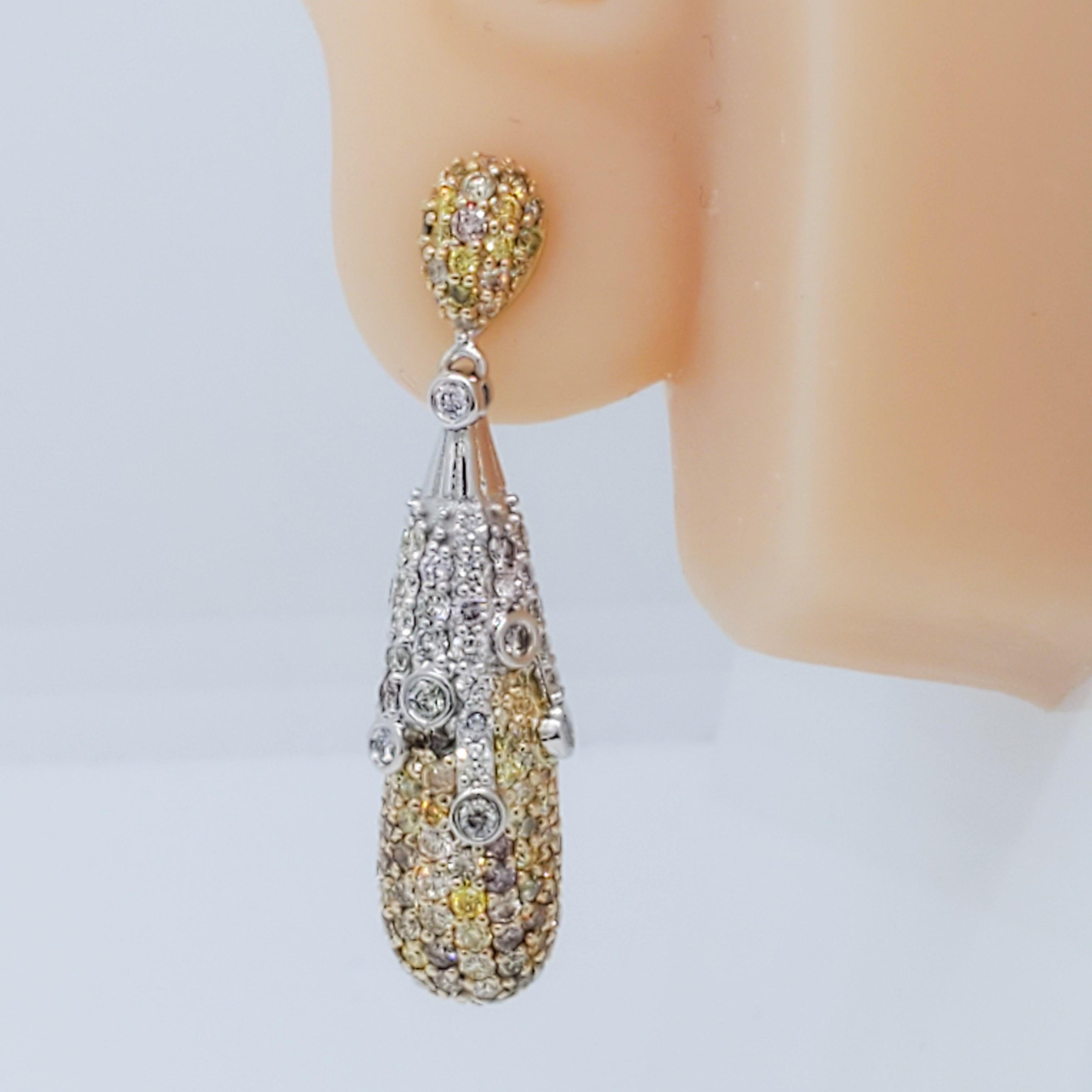 Beautiful dangle day and night earrings with 4.35 ct. good quality white diamond and yellow diamond rounds.  Both sides are not identical, they are opposite, making them day and night earrings.  Handmade in 14k white and yellow gold.  