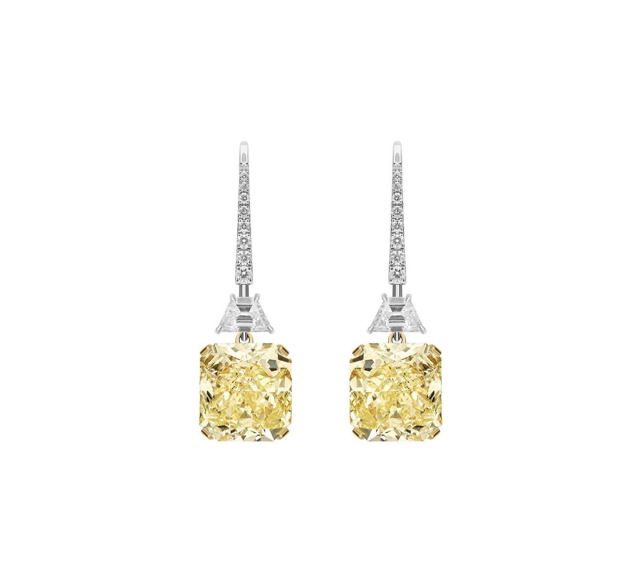 Beautiful Earrings featuring a well-matched 6.01 Carat with a 5.52 Carat. Both Certified by GIA as Fancy Light Yellow in color and VS1 in clarity.
11.53 Carat in total for a Unique and Magnificent pair.
Stones are rectangular and cut to maximize
