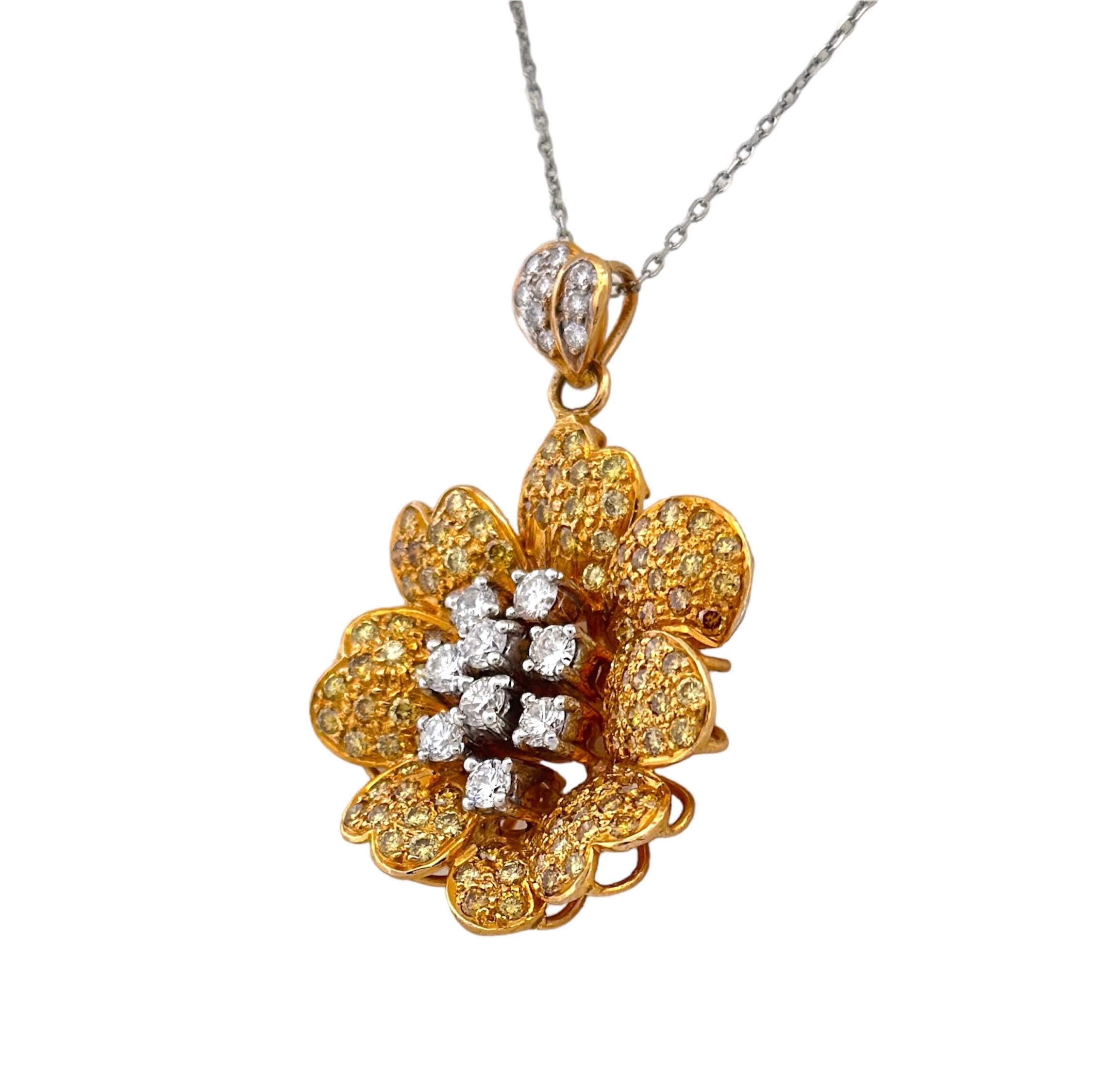 Step back in time to the 20th century and experience the opulence of this Yellow and White Diamond Flower Pendant. The focal point is graced by immaculate white diamonds, encircled by a dainty halo of lively yellow diamonds, resulting in a stunning