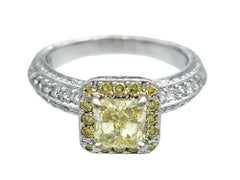 Yellow and White Diamond Halo Style Engagement Ring in Polished Platinum