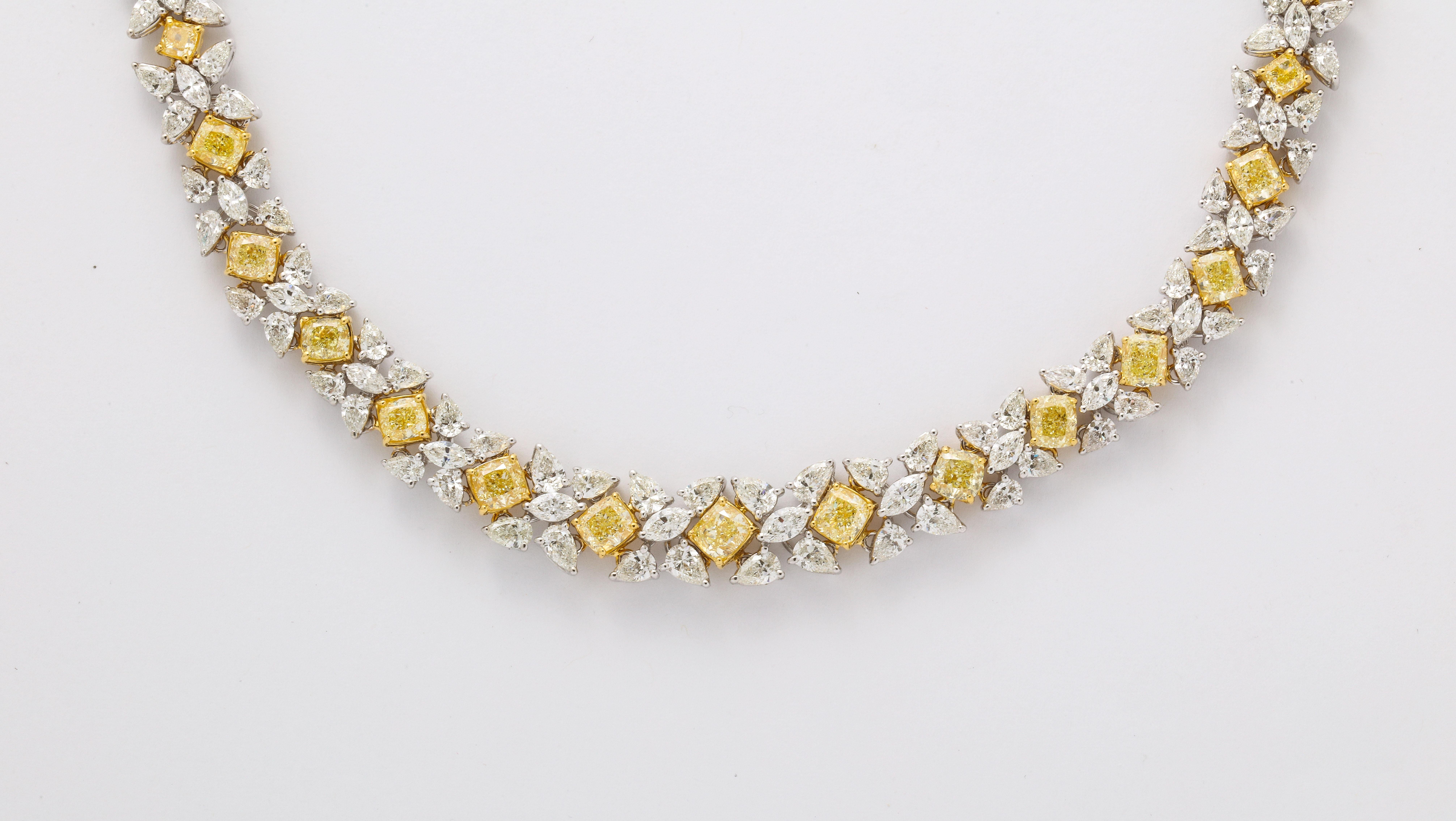 
An exquisitely designed piece! 

43.87 of Fancy Yellow and white diamonds set in 18k yellow and white gold. 

Fancy Yellow cushion cut diamonds are set between white pear and marquise cut diamonds. 

Featuring 2 locks with an extension - the