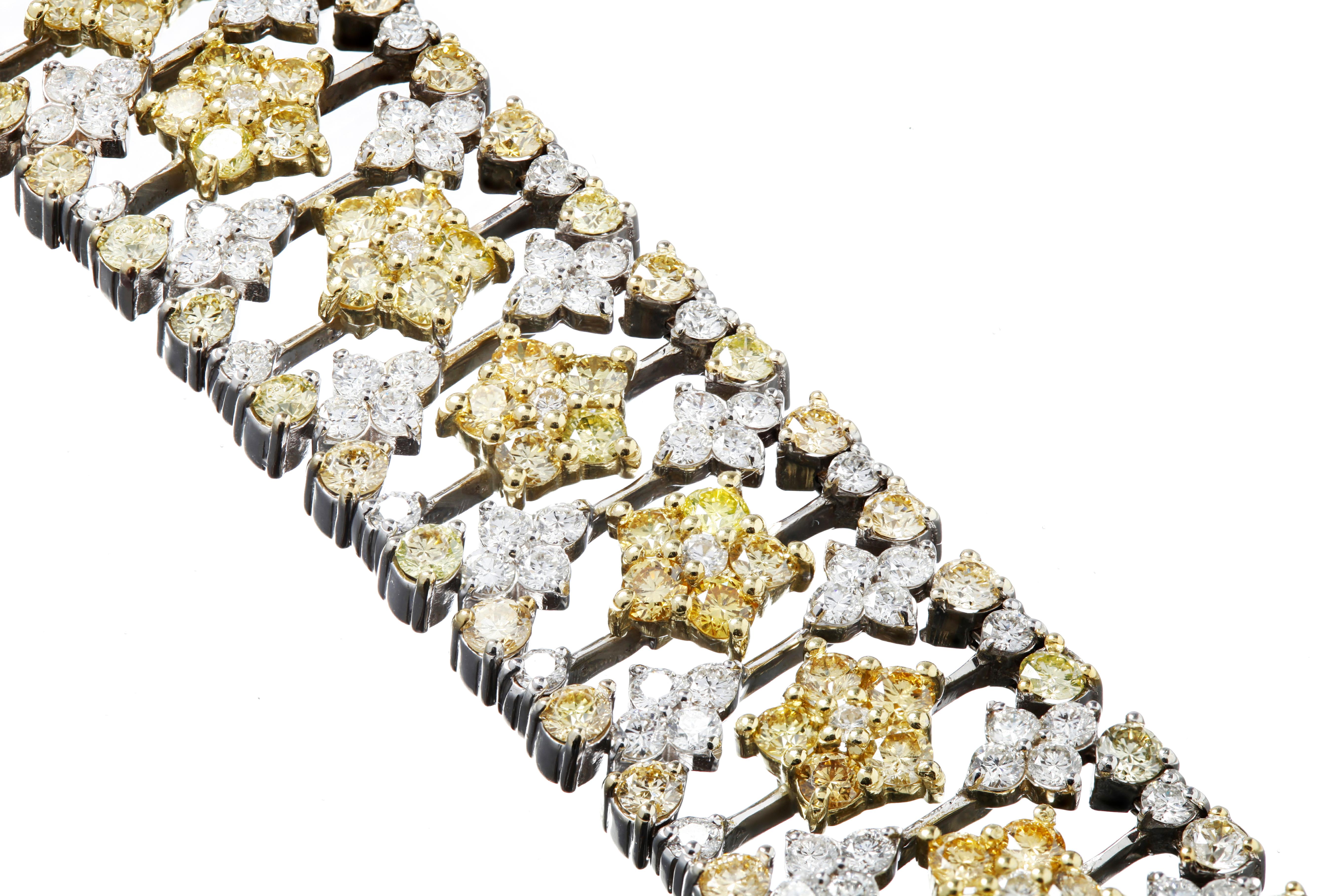 18K Two-Tone Gold Bracelet with White and Yellow Diamonds by Stambolian 

Bracelet has 7.80 carat G color, VS clarity white diamonds
12.69 carat Yellow Diamonds

Limited piece. This is one of only Three made.

Clasp is where it reads 
