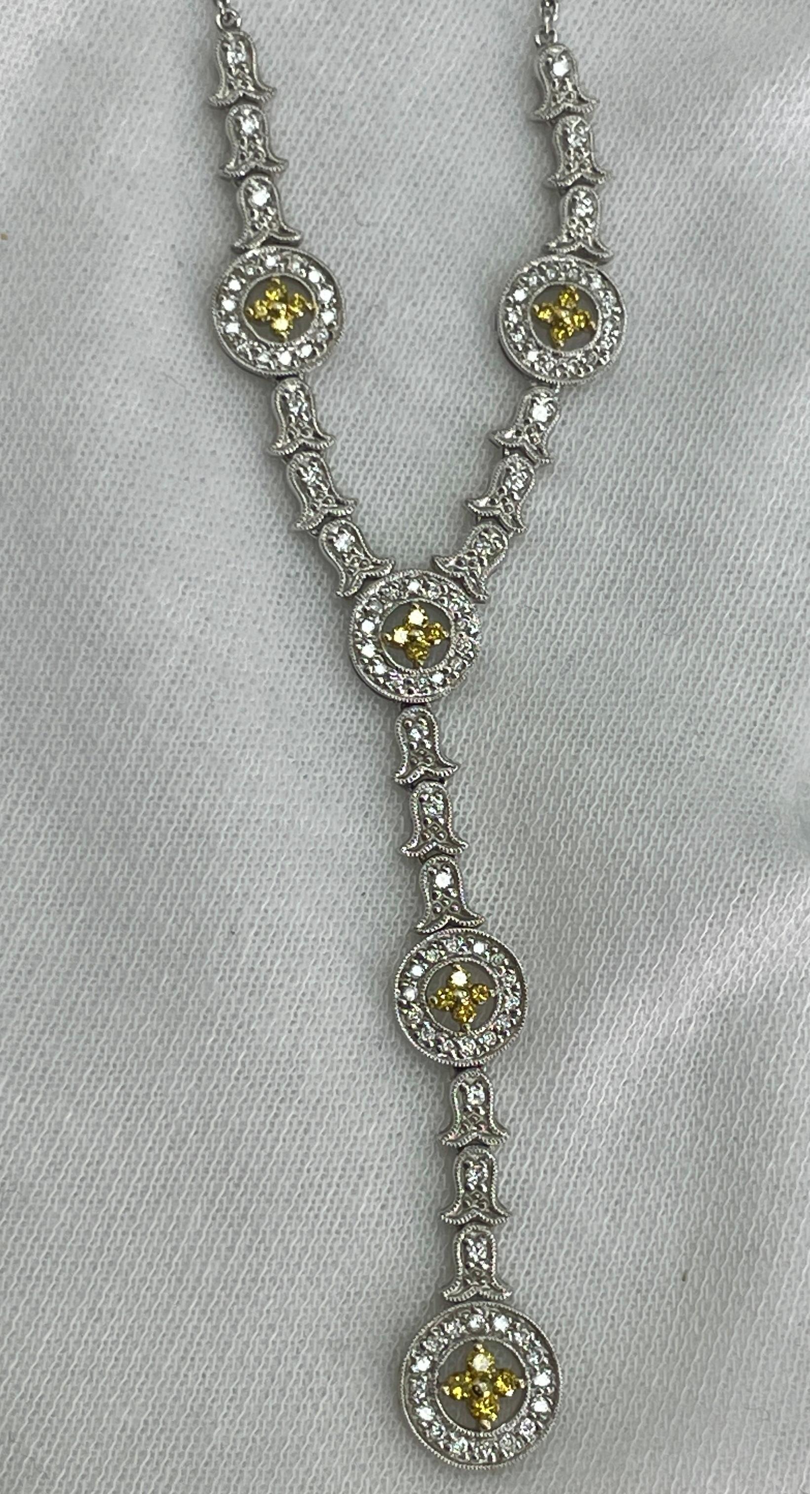 Y-necklace with 0.48Ct of white diamonds and 0.25Ct of brilliant yellow (canary) diamonds in 18K white gold